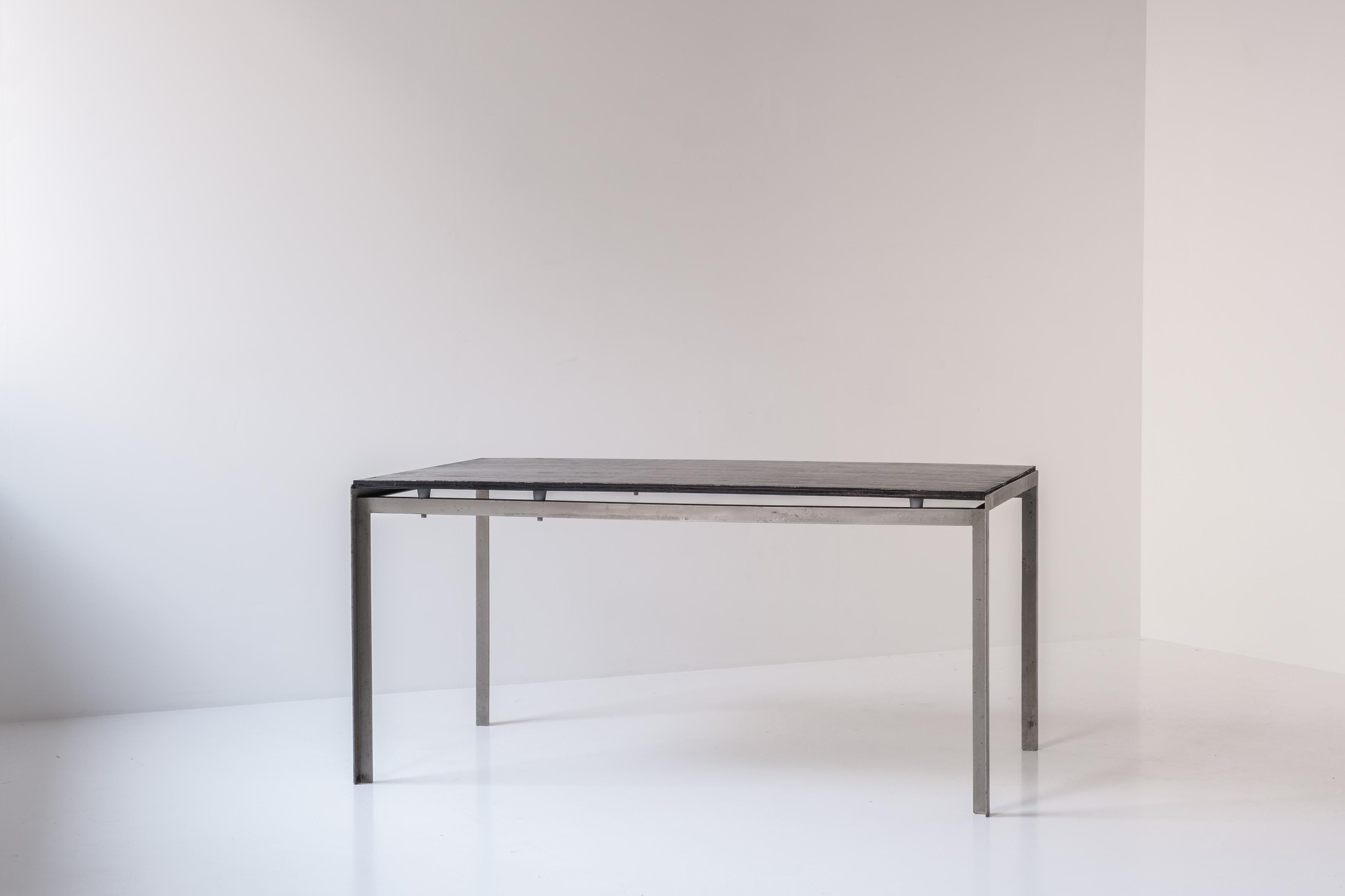 Admire this early PK-52 desk by Poul Kjaerholm for Rud Rasmussen, Denmark 1956. This desk was originally designed for the Royal Danish Academy of Fine Arts in Copenhagen. The desk features a base made out of welded metal and a black stained Oregon