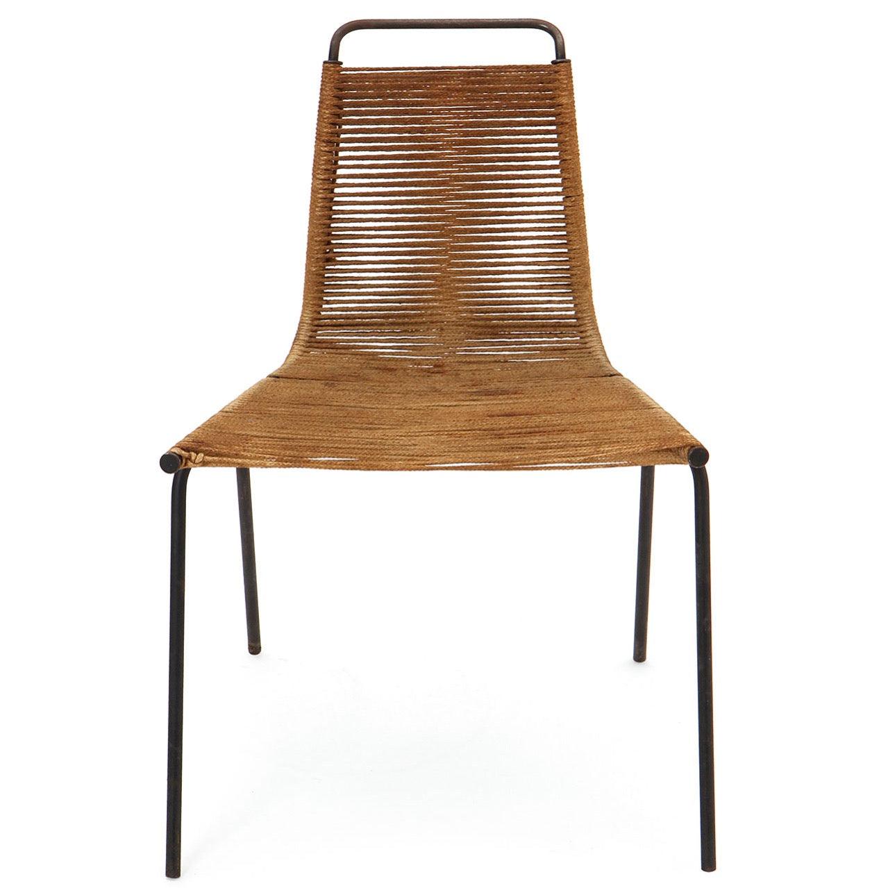 A first-production example of the PK1 chair, having a refined and minimalist frame of bent steel rod with seat and back strung with flag halyard.