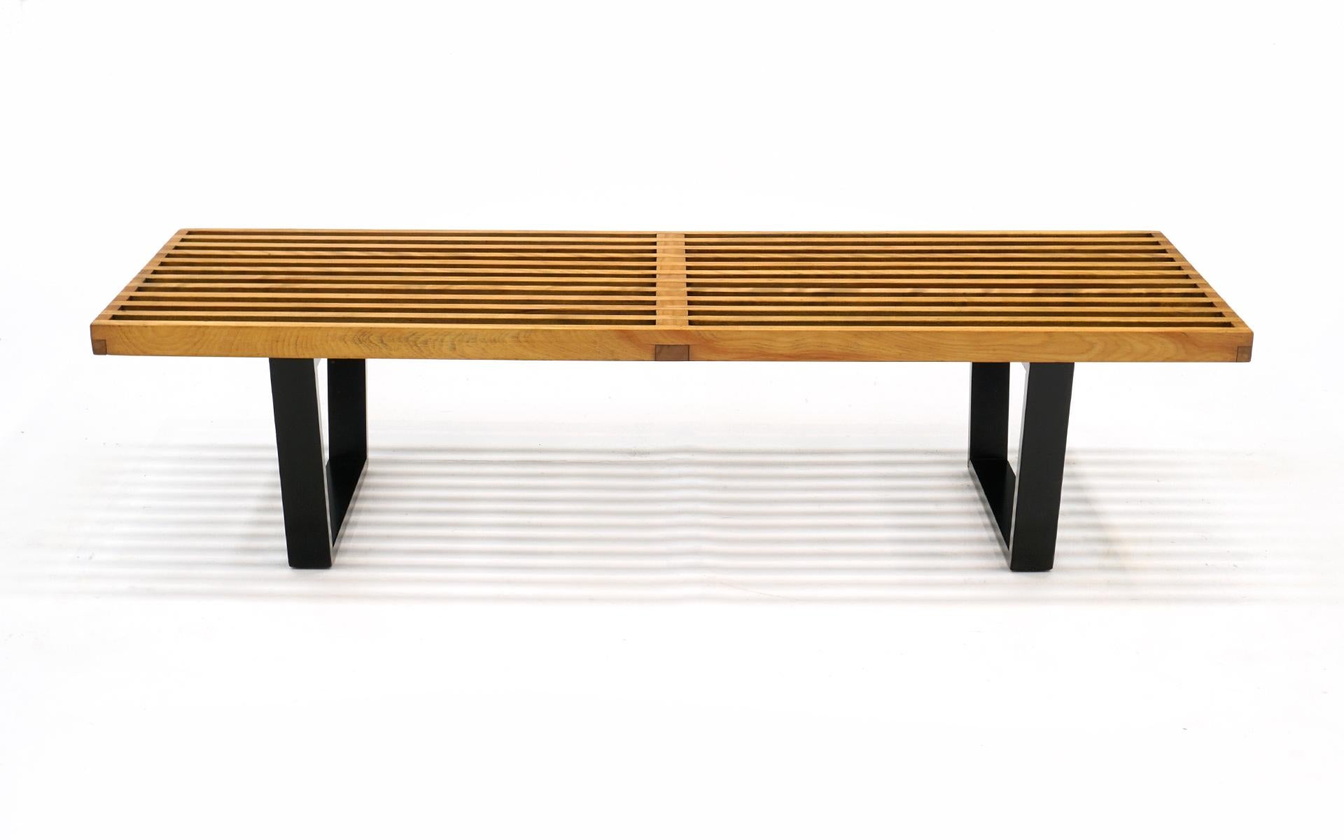 Early primavera finish slat platform bench designed by George Nelson for Herman Miller. This is a 1950s original and not the later reissue. Beautiful patina. Show some signs of use in the form of small dents and scratches but nothing that distracts