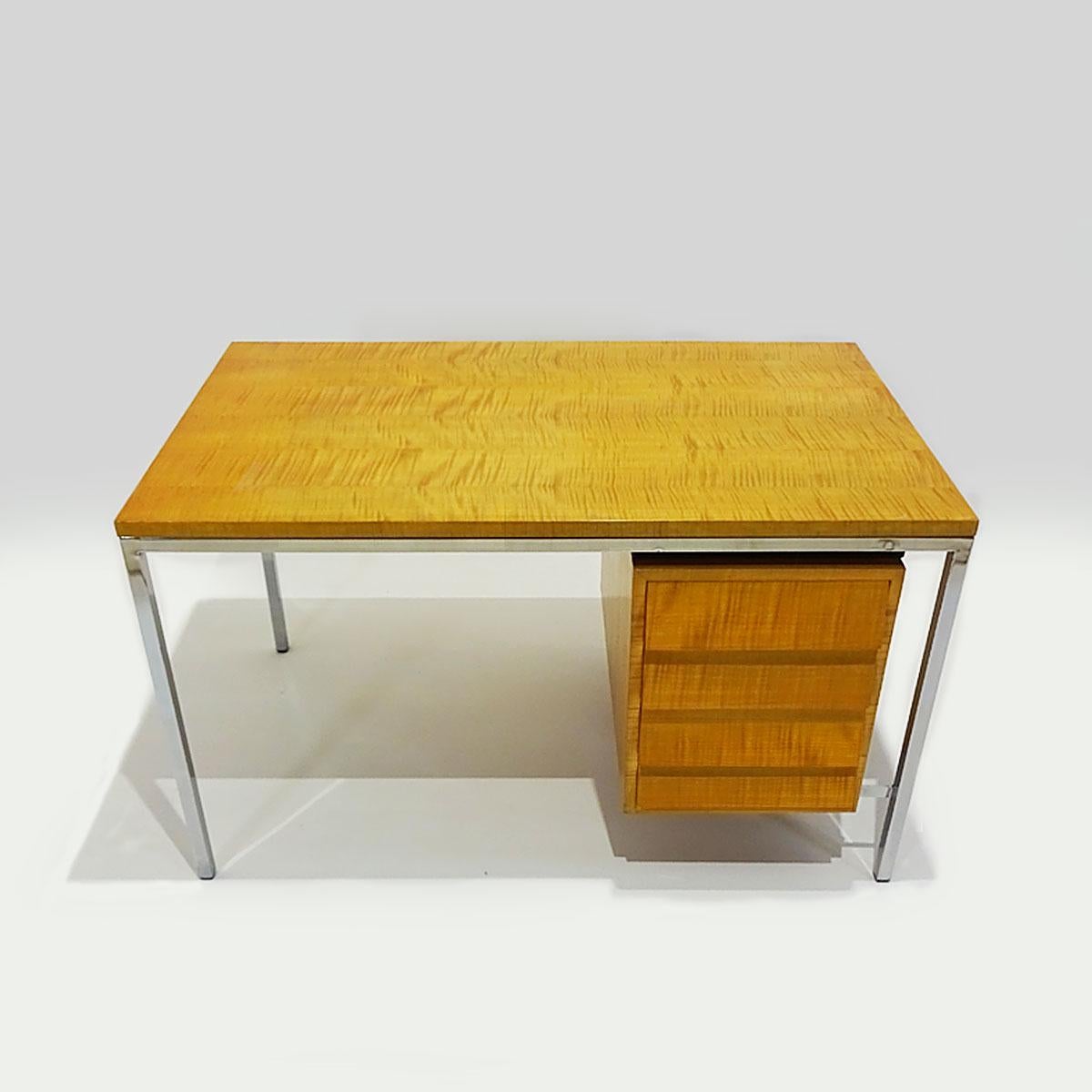 A truly rare and beautiful late 1940s desk constructed in polished steel and Tiger Stripe maple attributed to Florence Knoll and marked ’01 FK’.

The earliest of all FK’s desks that entered the main stream was the model 17 wooden desk constructed