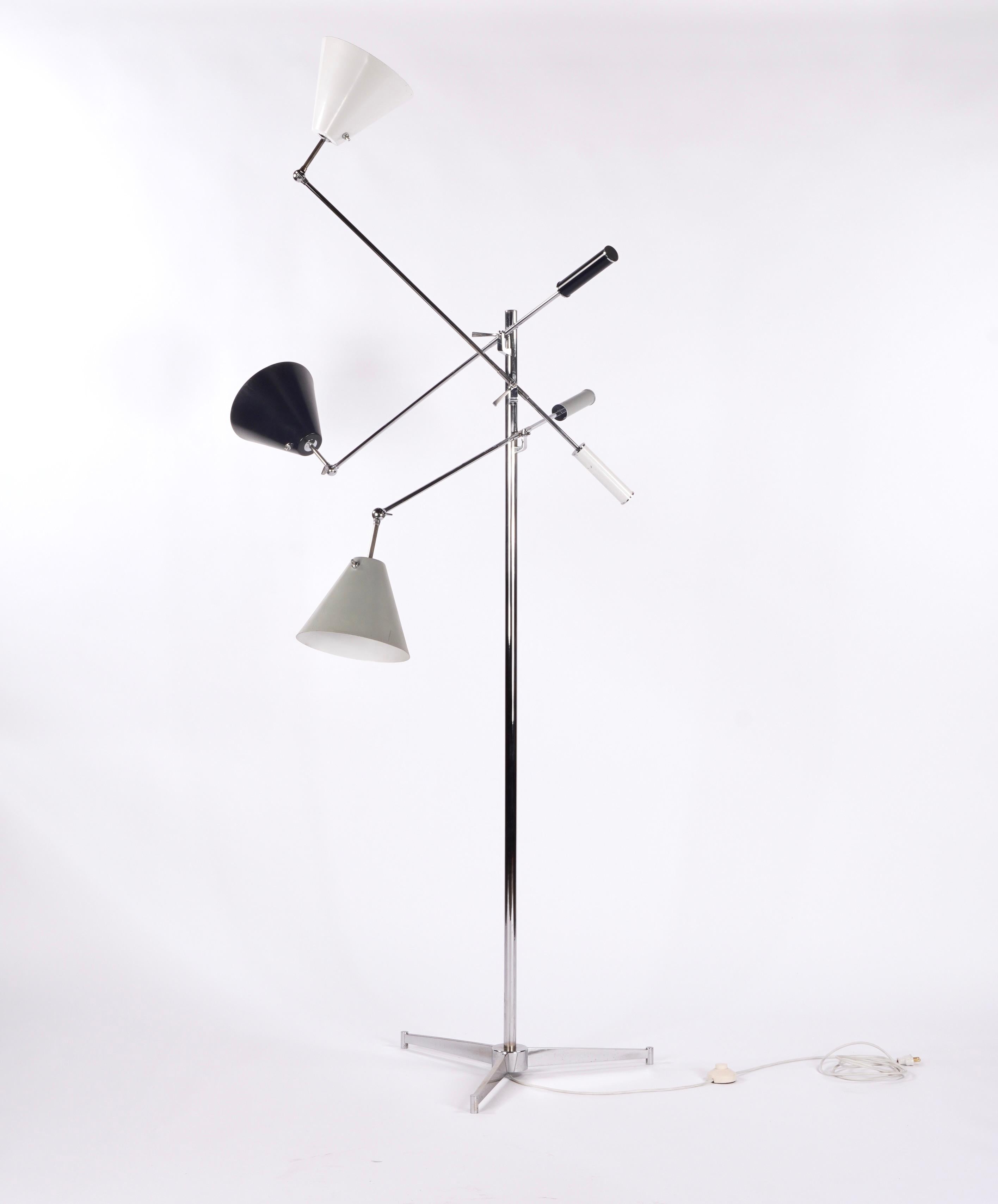 Early 1950s Arredoluce Triennale floor lamp by Angelo Lelli, with enameled aluminum shades in white, black and gray with a chrome base, Stamped on the bottom of the base and inside the shades, Made in Italy Arreodoluce Monza. The lamp arms measure