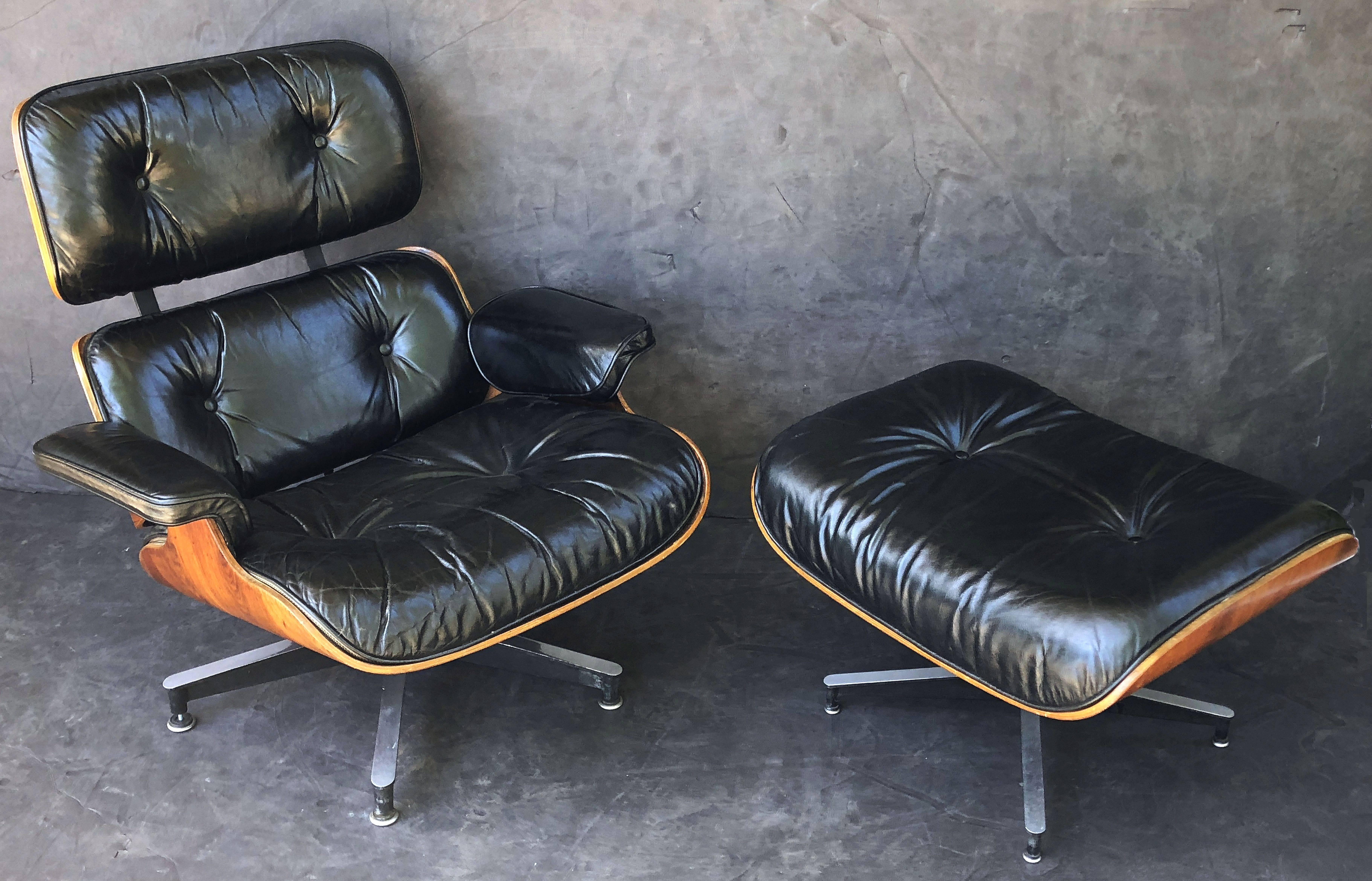 A fine early production Eames lounge chair with ottoman (model: # 670/671) by Herman Miller, circa 1959, with original tufted black leather upholstered cushions. The Brazilian rosewood (Rio Palissander) has a beautiful wood grain and is in excellent