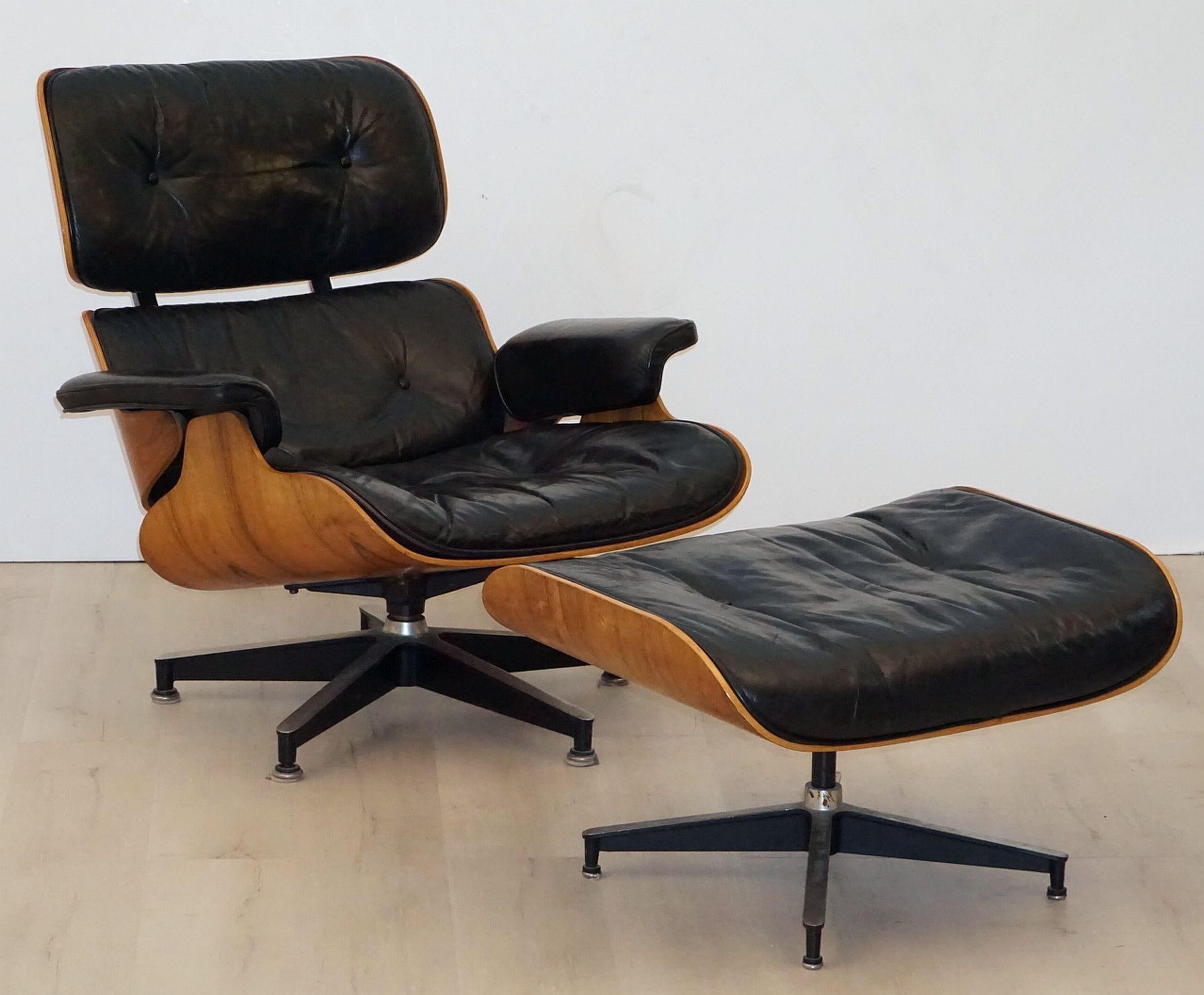 A fine early production Eames lounge chair with ottoman by Herman Miller, circa 1965, with original tufted black leather upholstered cushions. 
The Brazilian rosewood (Rio Palissander) has a beautiful wood grain and is in excellent vintage