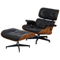 Early Production Charles and Ray Eames Rosewood Lounge Chair with Ottoman