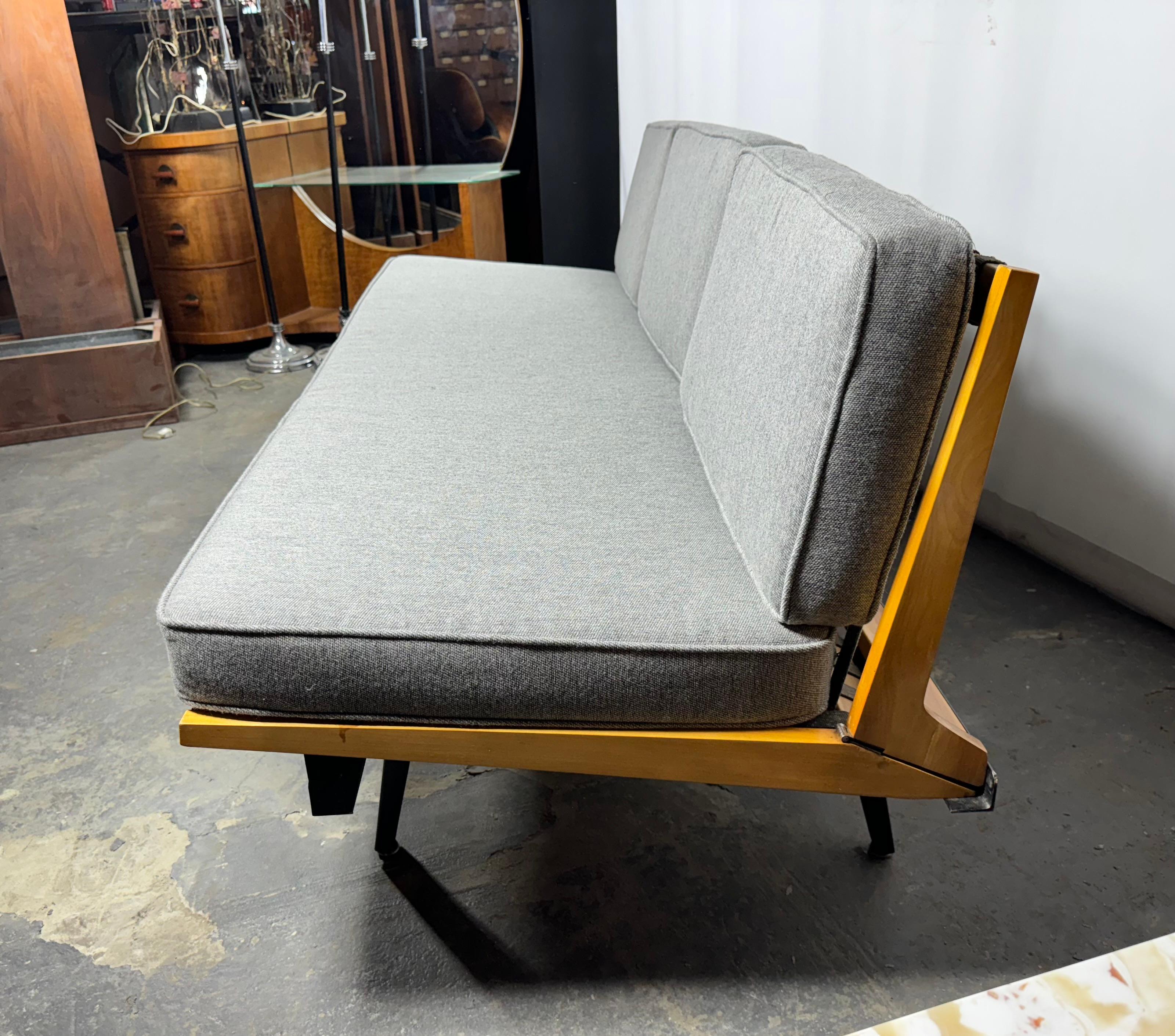 Early Production George Nelson / Herman Miller Modular Steel Frame Sofa,, Professionally reupholstered. Stunning gray wool fabric.  Retains original steel frame , three segmented folding seats in birch, also retains its original strapping..Classic
