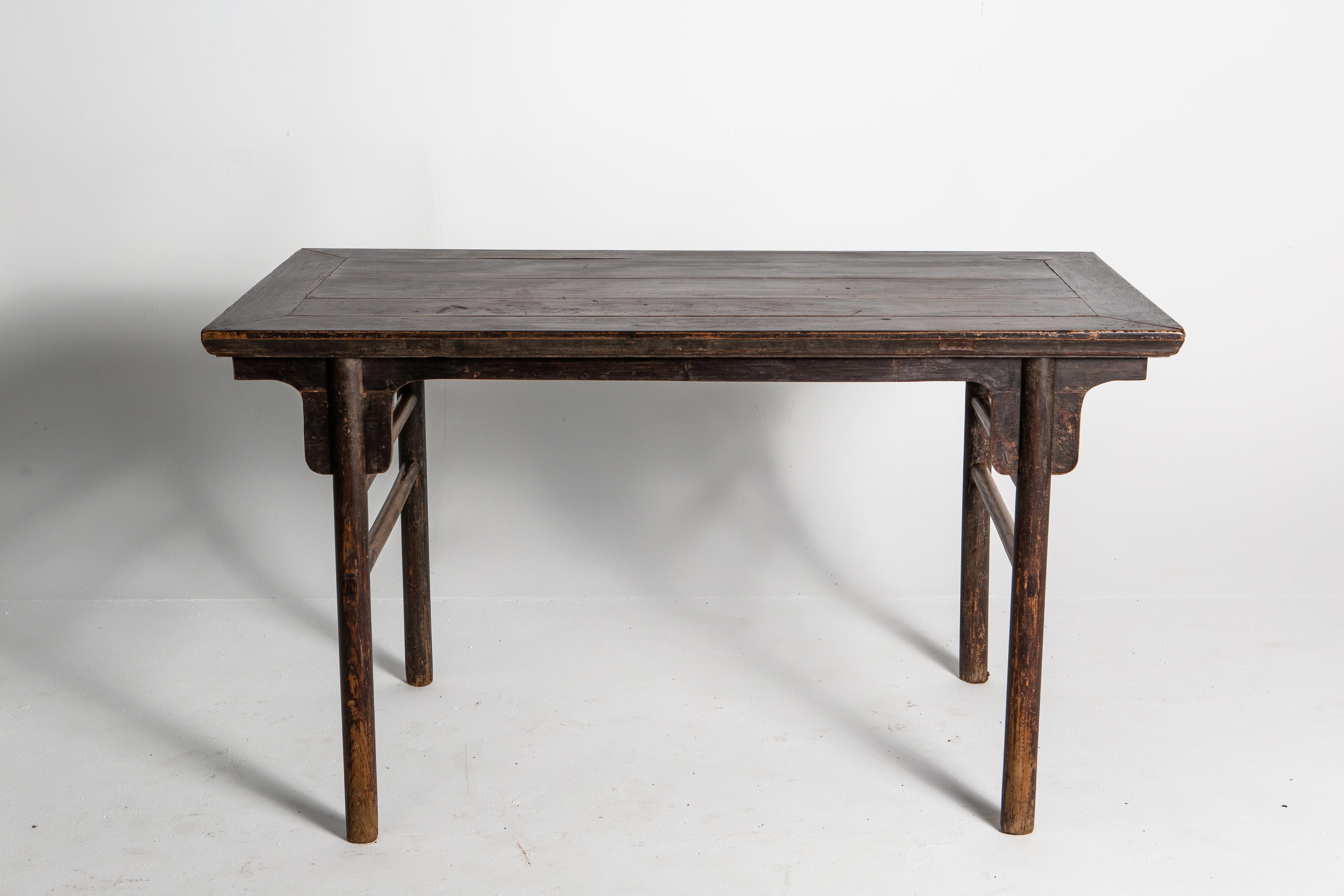 This tall and elegant Chinese scholar’s table was once used for calligraphy. The piece is usually simple and pure base on Ming dynasty furniture theory. Round legs were thought to be closer to nature and produced a feeling of calm in the user. The