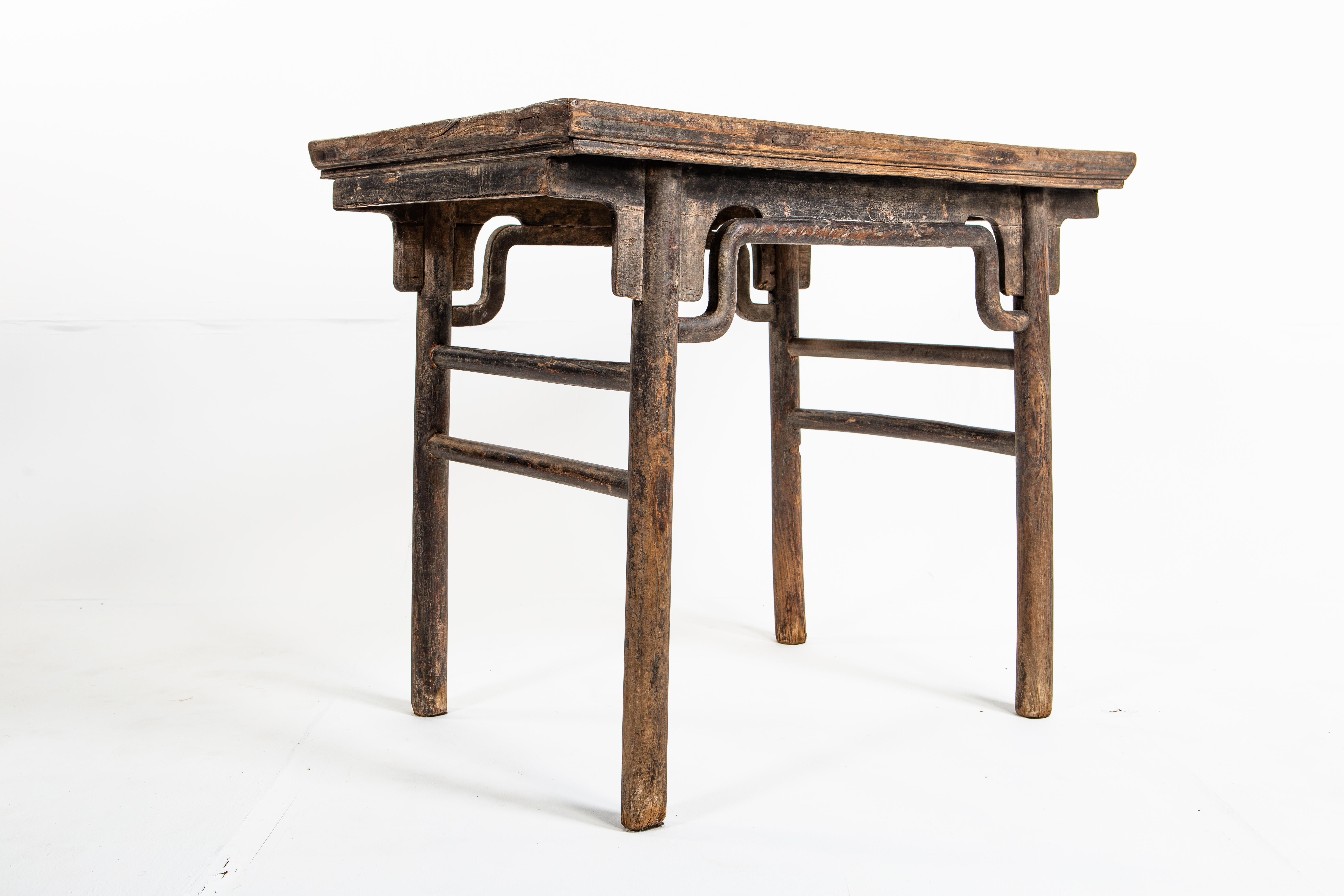 Rectangular drawing table with round legs and original lacquer finish. This table dates back to the early-Qing dynasty and was from Shanxi Province, China. Piece has a beautifully aged patina.