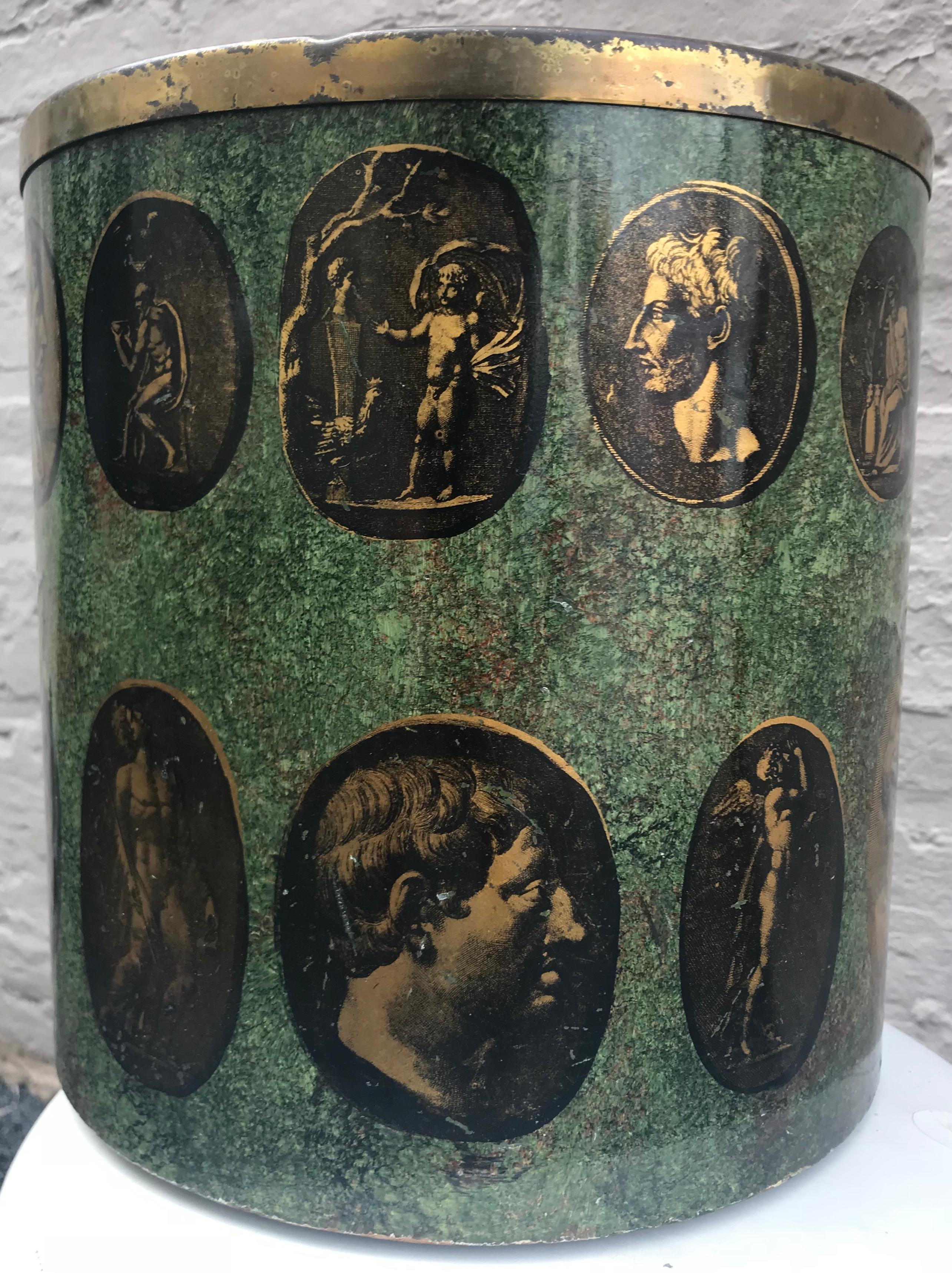 Wonderful and rare early production Fornasetti wastebasket from the early 1950s with lithographed classical images and green faux marble decoration. Wonderful wear to surface.