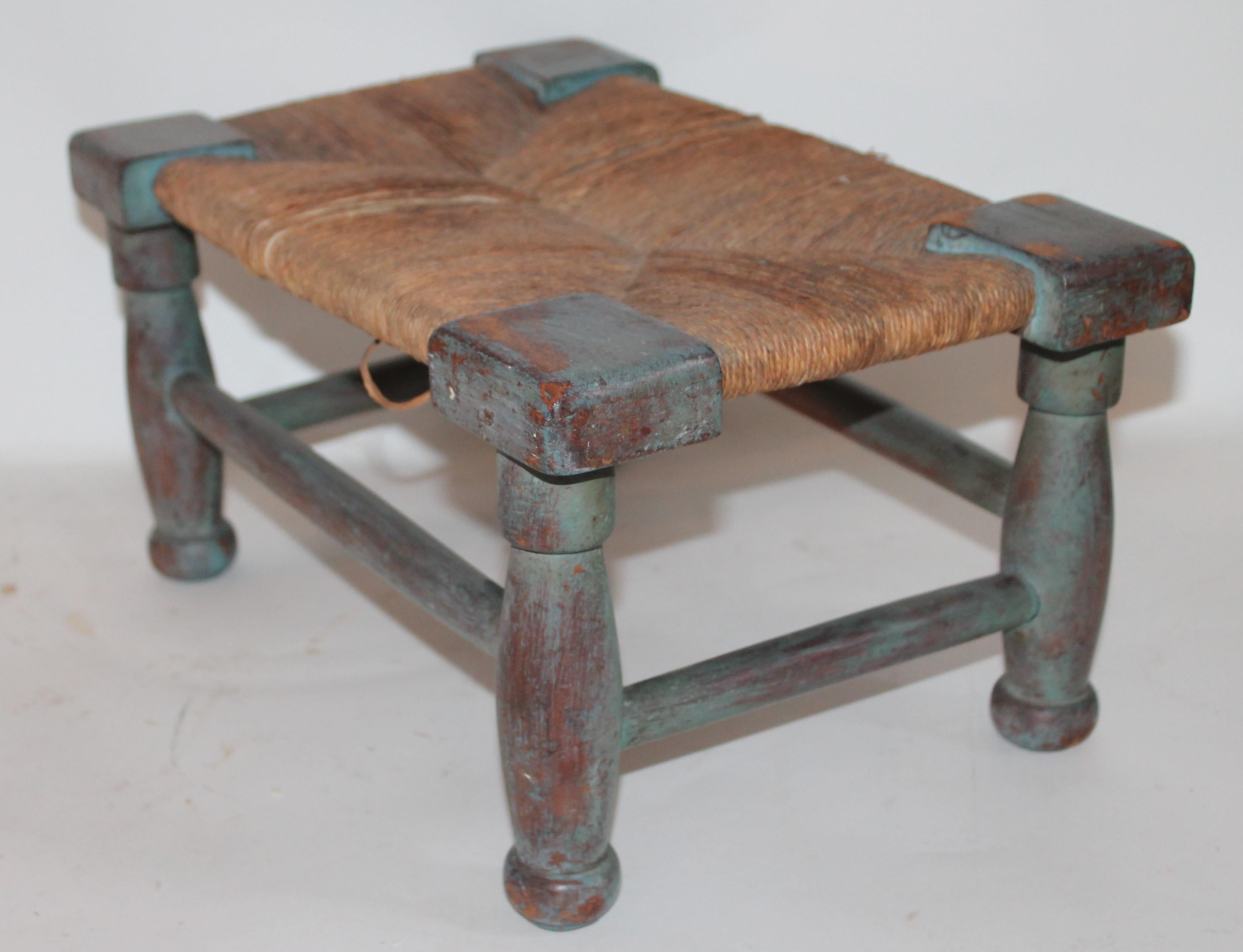 Amazing untouched robin egg blue painted 18th century handmade foot stool with the original handmade rush seat .This stool was found in the state of Maine .It is constructed of handcut nails and the best blue painted surface.