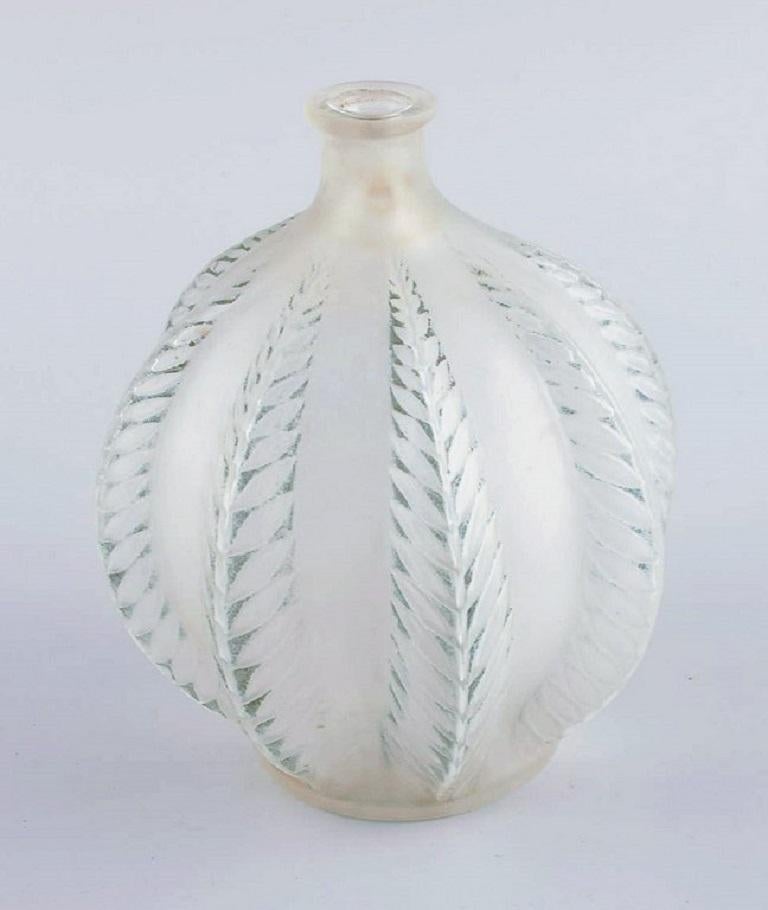 Early René Lalique, Malines vase in clear art glass in green model.
Model No. 957.
Signed 