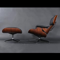 Früher Eames-Loungesessel und Ottomane aus Palisanderholz von Herman Miller aus schwarzem Leder