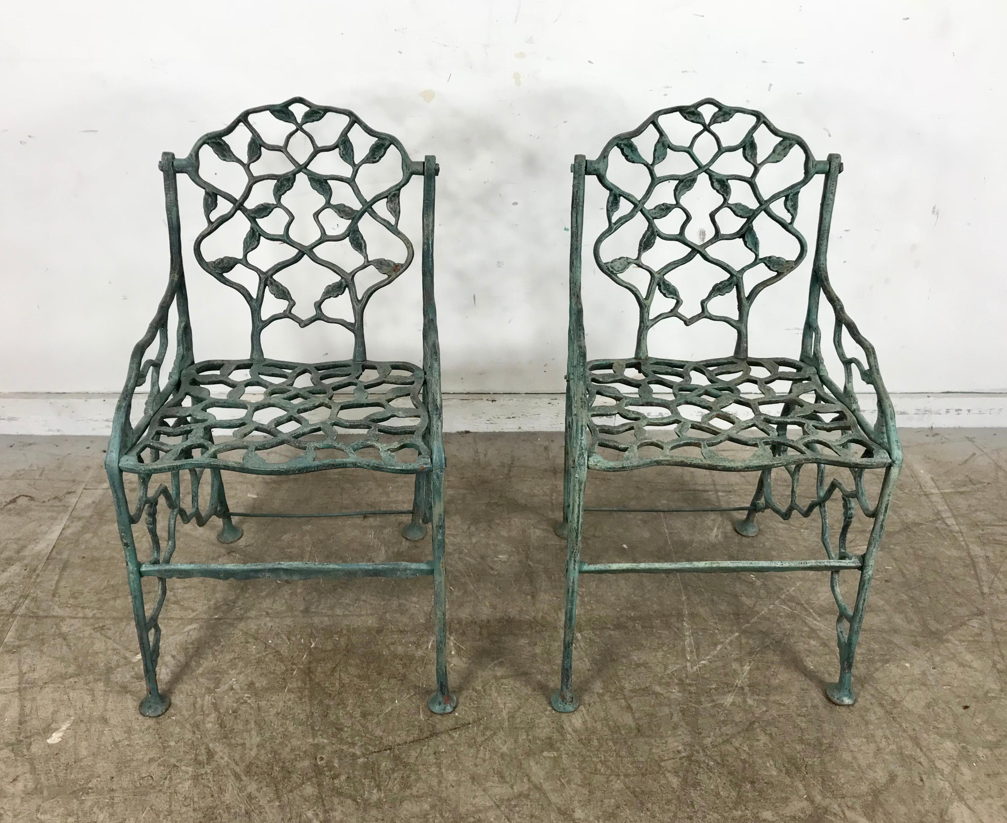 Early rustic cast iron garden chairs 