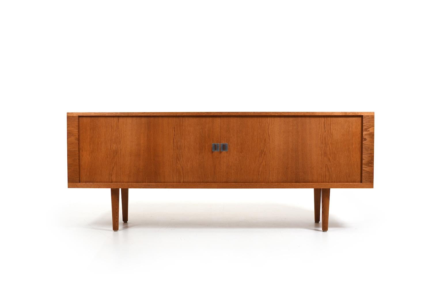 Sideboard, model RY25 in finest oak by Hans J. Wegner for RY Møbler 1950s In front with sliding doors and inside with shelfes and drawers. Doors with beautiful handles. Early production, 1950s In good vintage condition, beautiful patina and selected