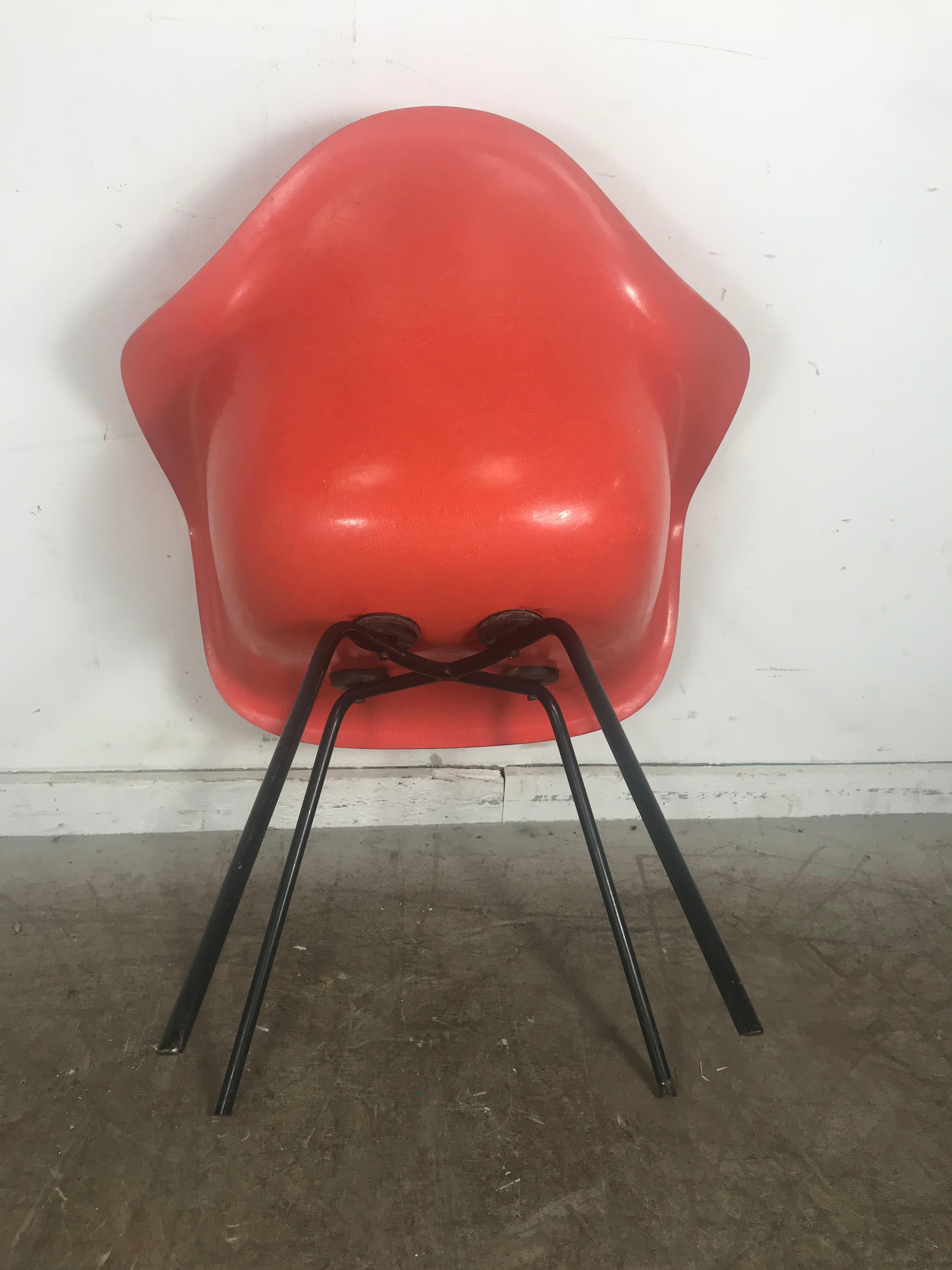 20th Century Early Salmon color Charles and Ray Eames Arm Shell Chair, 2nd generation X base For Sale