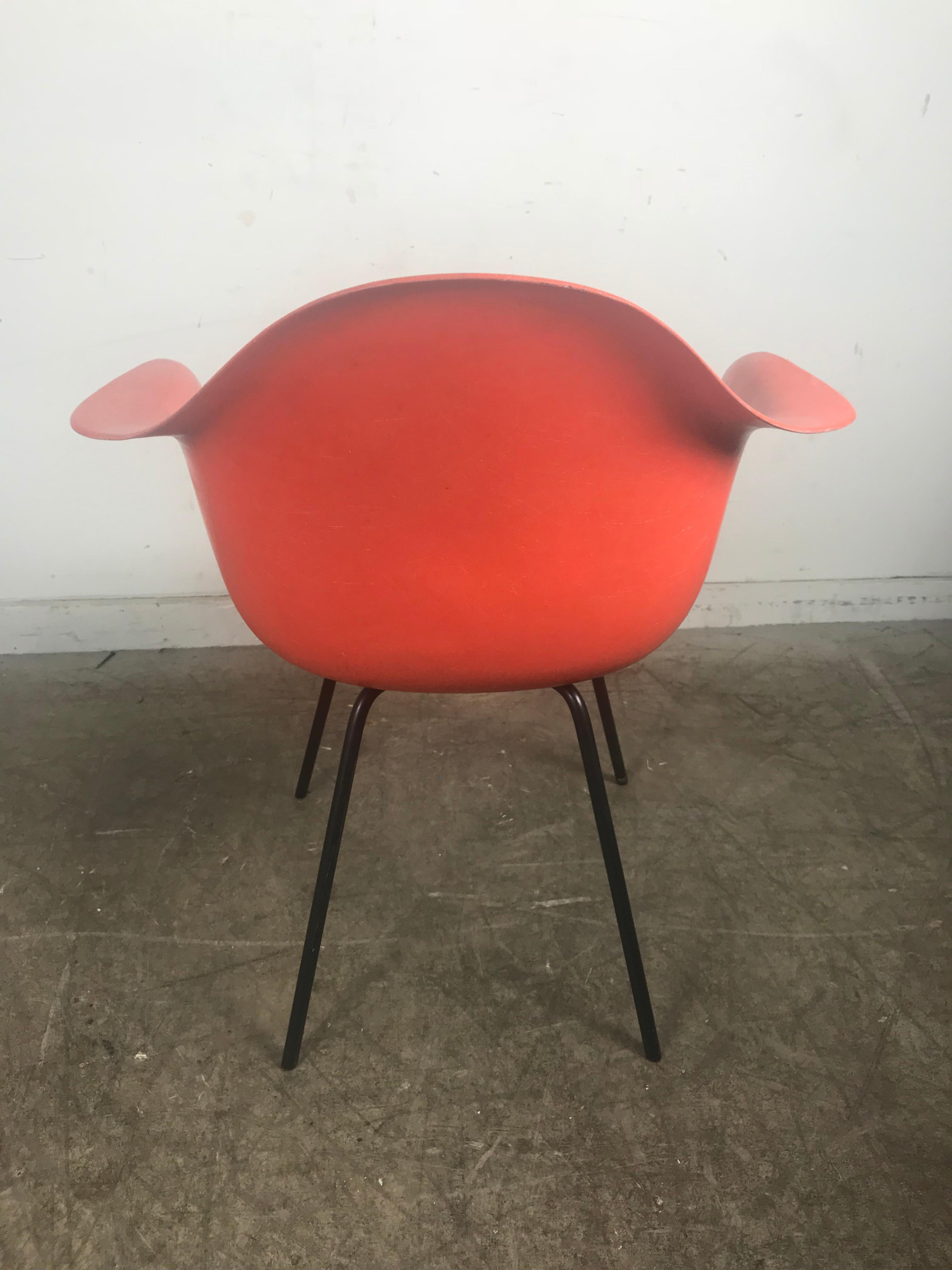 Iron Early Salmon color Charles and Ray Eames Arm Shell Chair, 2nd generation X base For Sale