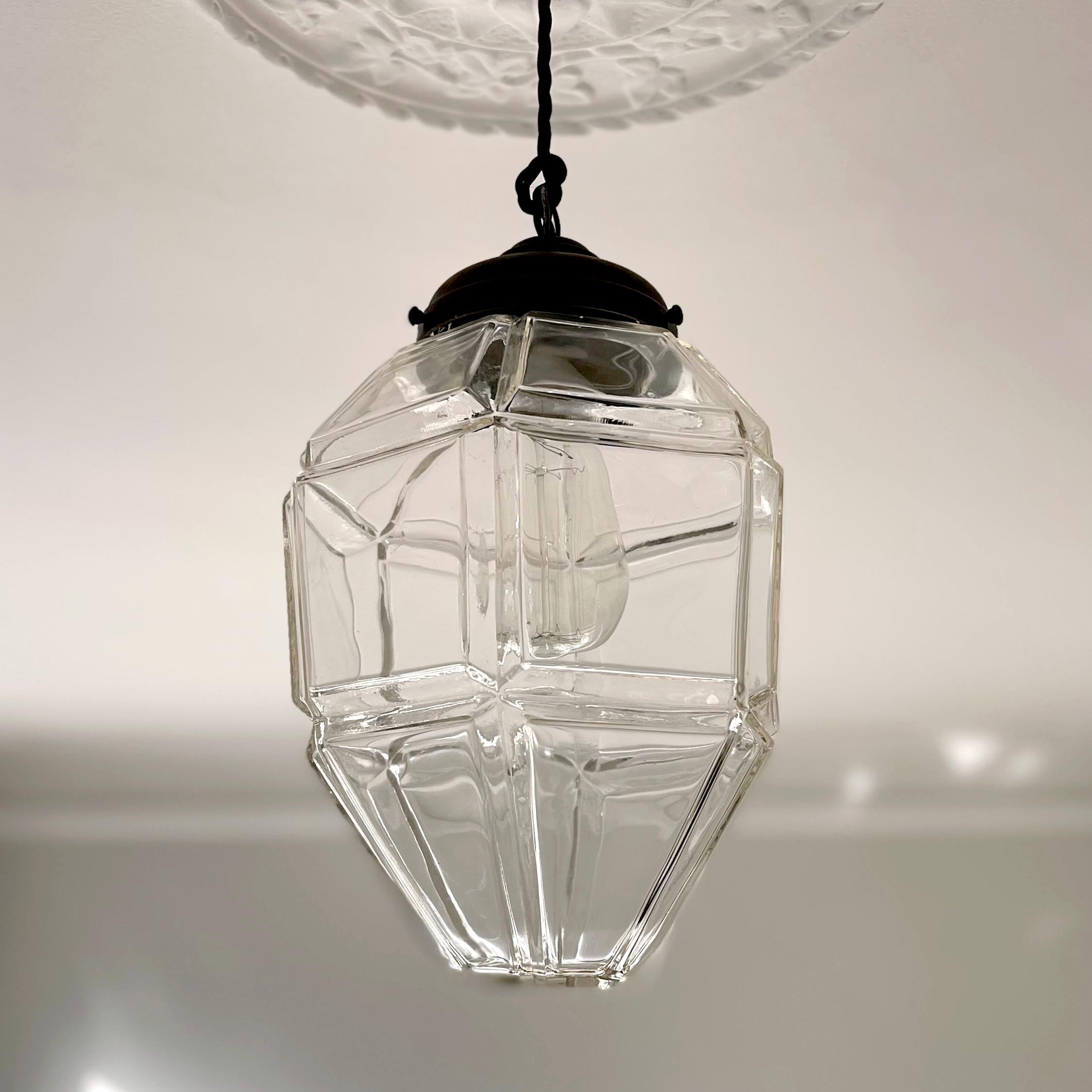 Early Scandinavian Modern

A beautiful pendant with clear glass shade and patinated brass mounting. Denmark, circa. 1911. 

The provenance of this lamp is from the railway station in Copenhagen by architect Heinreich Wenck, inaugurated in 1911 by