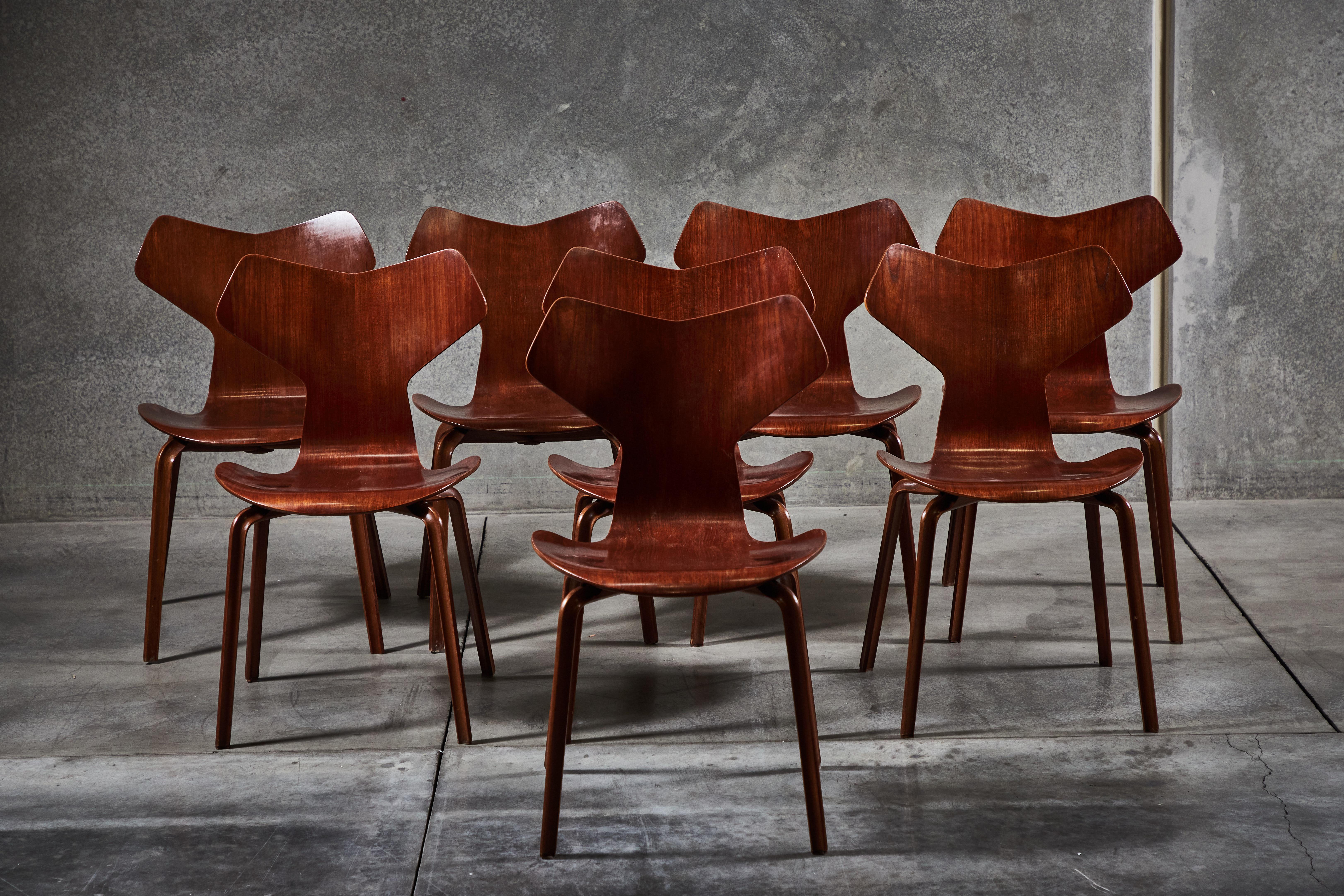 Eight first generation model 4130 “Grand Prix” chairs in teak by Arne Jacobsen for Fritz Hansen. Made in Denmark circa 1957.
