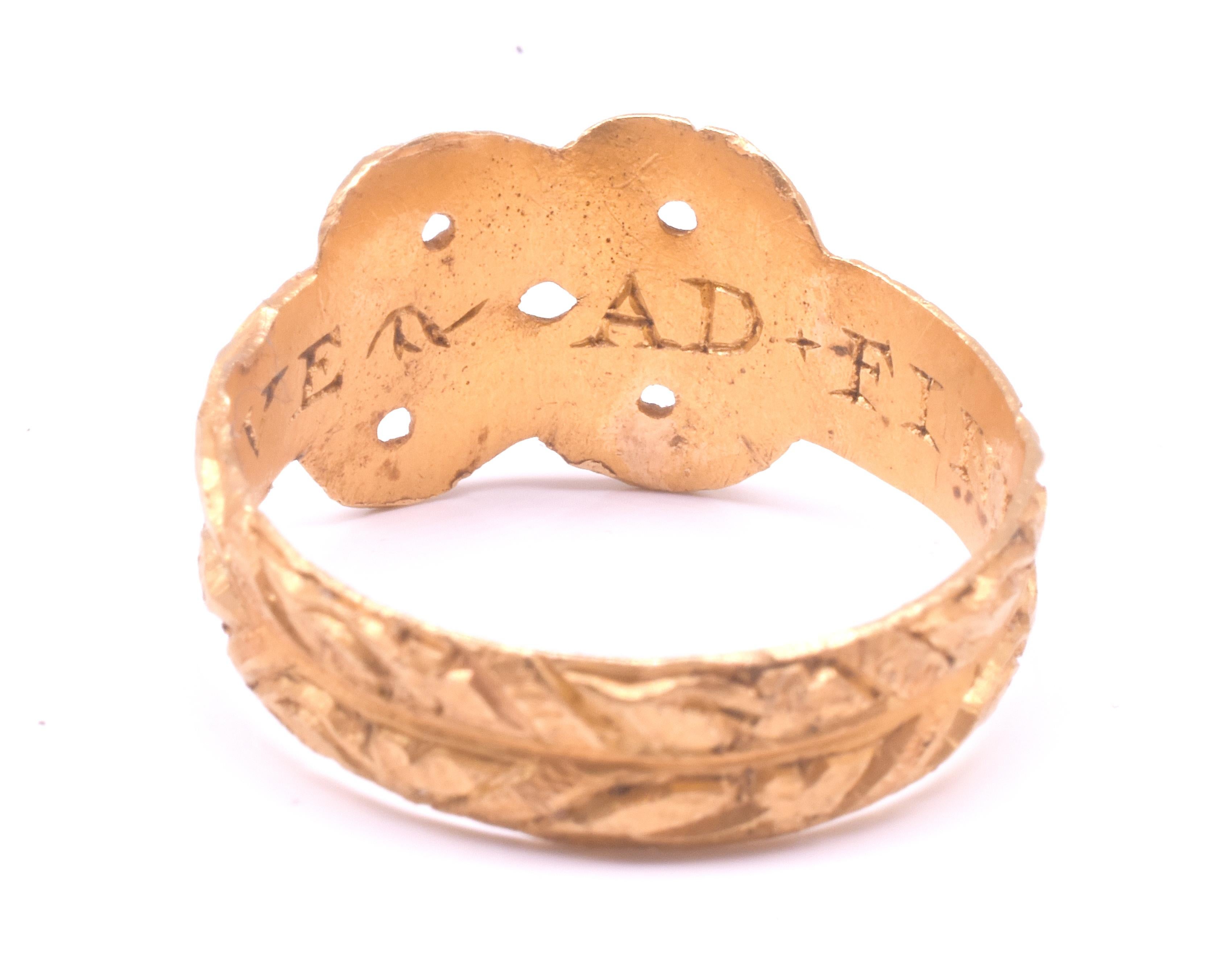 Anillo Posey de principios del siglo XVII con forma de nudo de amor 