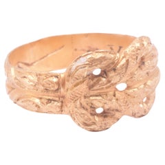 Bague de Posey du début du XVIIe siècle en forme de nœud d'amour "Usque Ad Finem