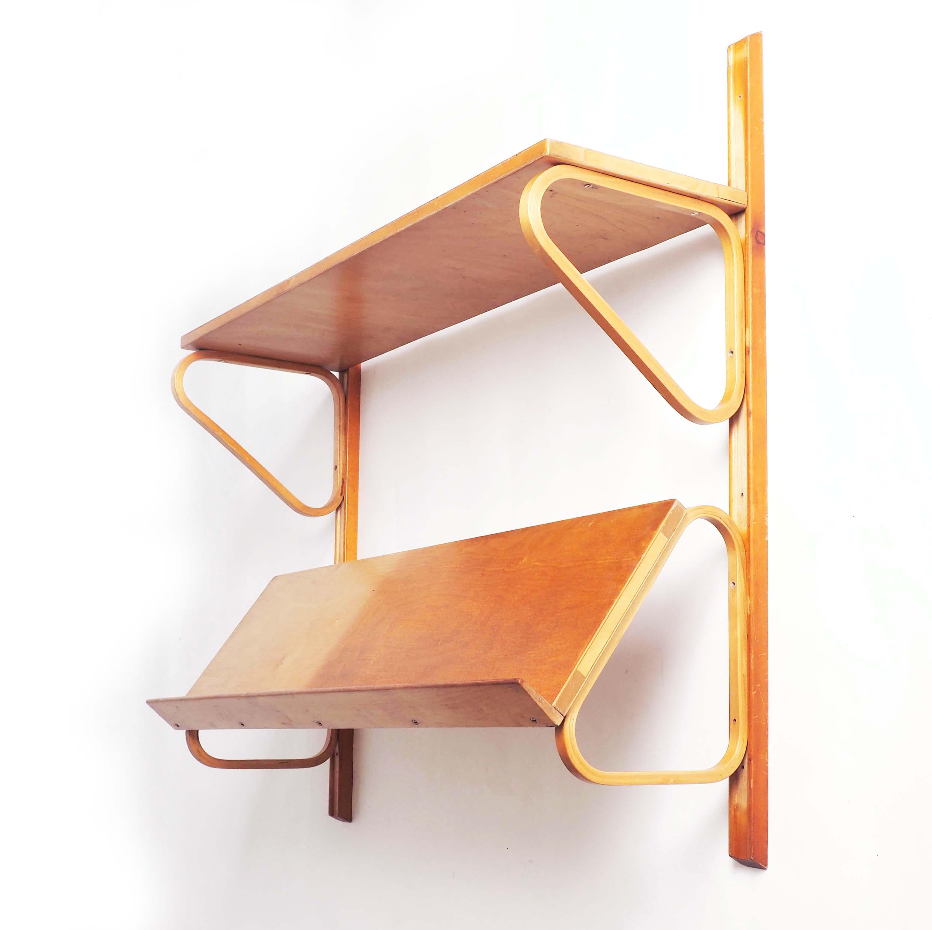 During the 1940´s Alvar Aalto had a production of his furniture in Hedemora, Sweden. This beautiful shelf is from that period. It comes with original wall mounts but can be mounted without them as well. All parts are made in birch.