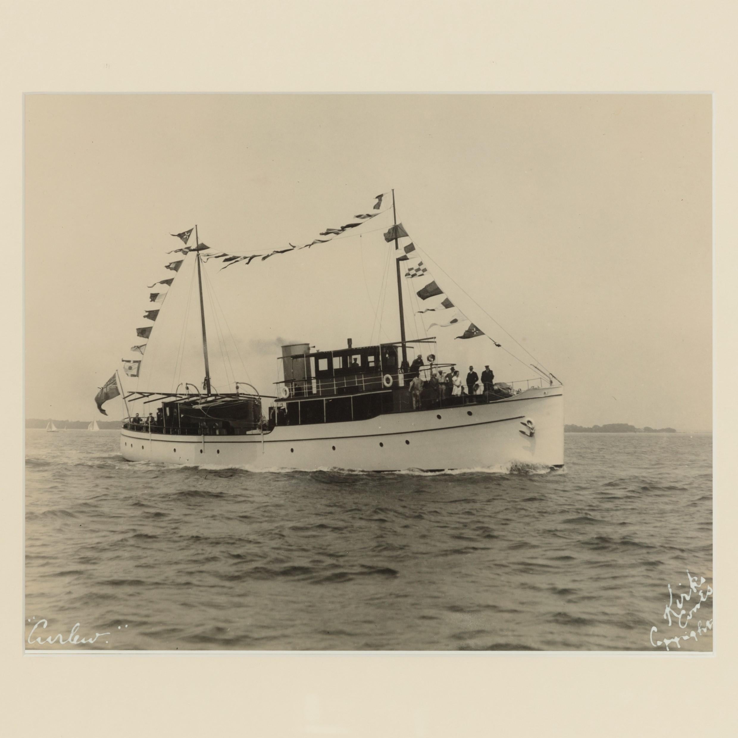 Early silver gelatin photographic print of the sailing yacht Curlew dressed overall, by Kirk and sons. Signed in white ink.

William Umpleby Kirk (Kirk and Sons) A photographer of the late Victorian era. Born in Hull and grew up nearby where, in
