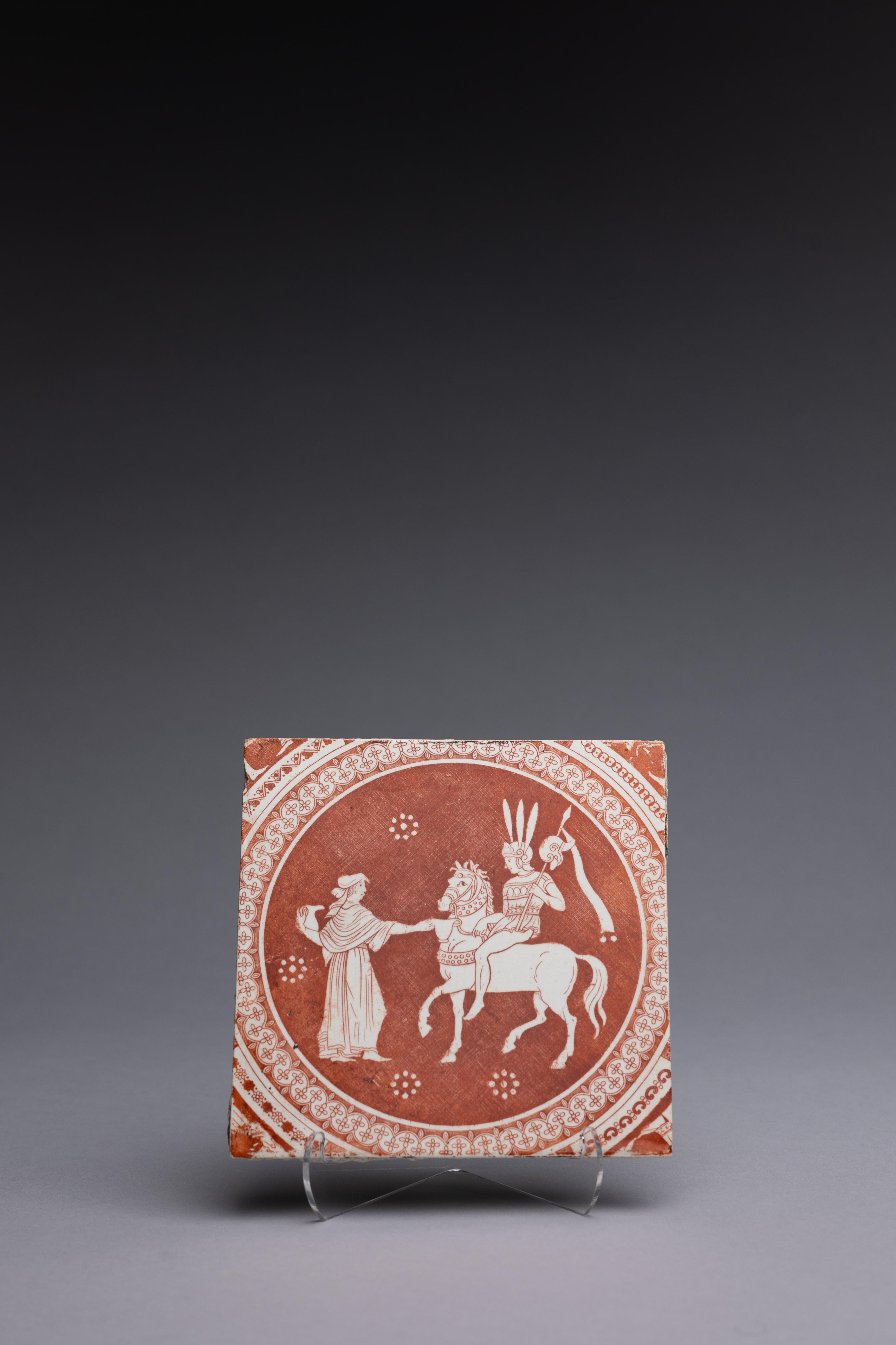 A Neoclassical red transferware tile made by Spode 1806-1810, with the ‘Refreshments for Phliasian Horseman’ pattern.

Sir William Hamilton’s Collection of Etruscan, Greek and Roman antiquities, first published in 1766 by Pierre d’Hancarville, was a