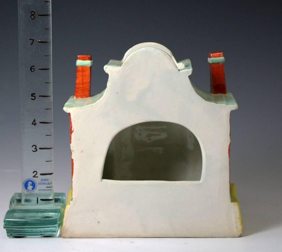 A rare early Staffordshire pearlware pottery pastille burner in the form of a mansion house.
 