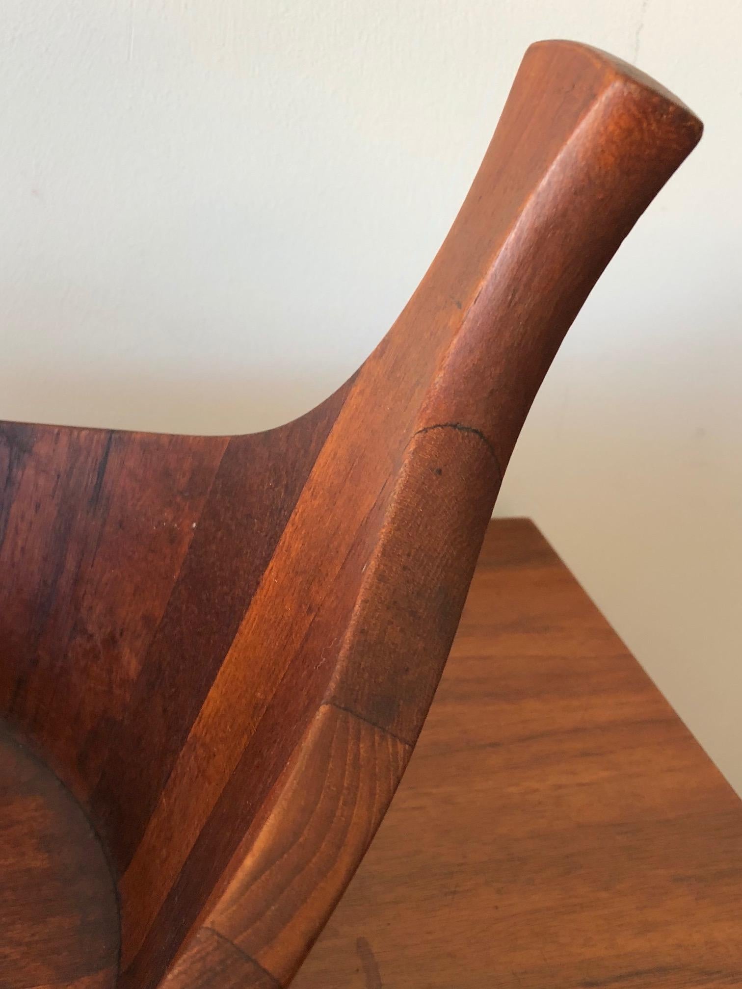 A rare and hard to find, large teak bowl by J.Quistgaard. Unusual form with raised handles and great patina.