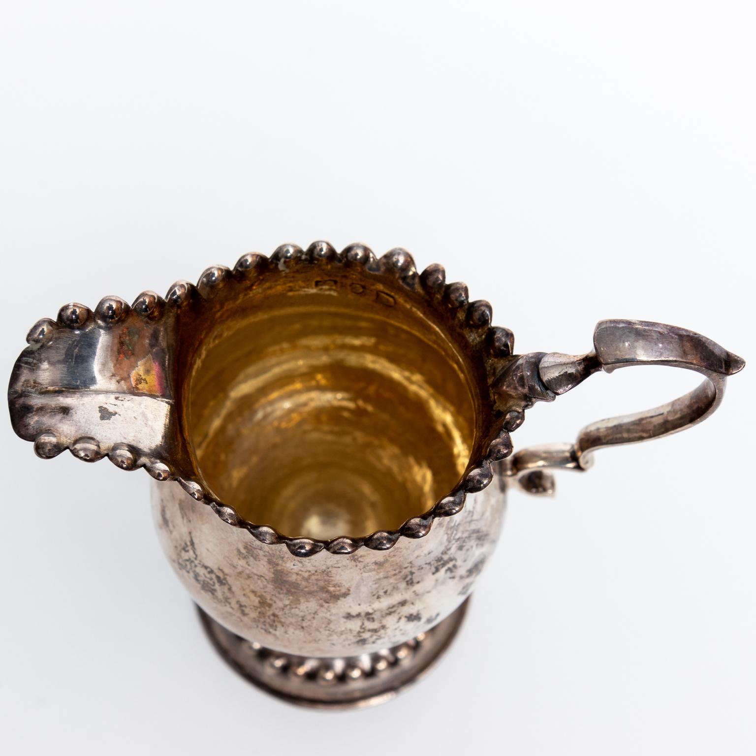 Sterling creamer was made in London in the 18th century. It appears manufactured by hand. Weighs 84 grams. Please note of wear consistent with age.