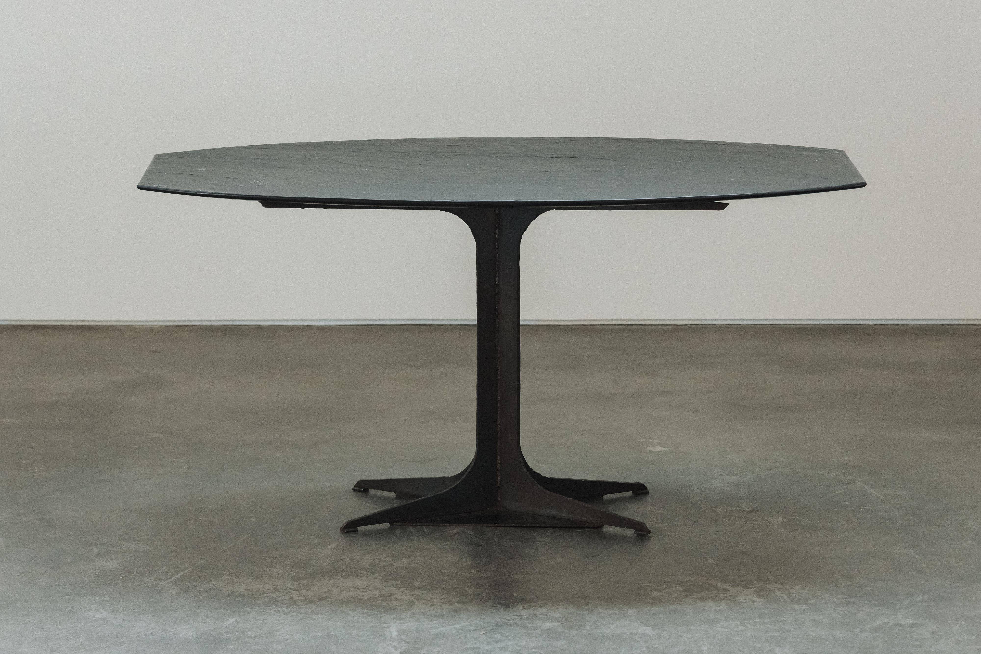 Early Stone Center Table From France, Circa 1900.  Solid stone top on a steel base.  Very light wear and use.