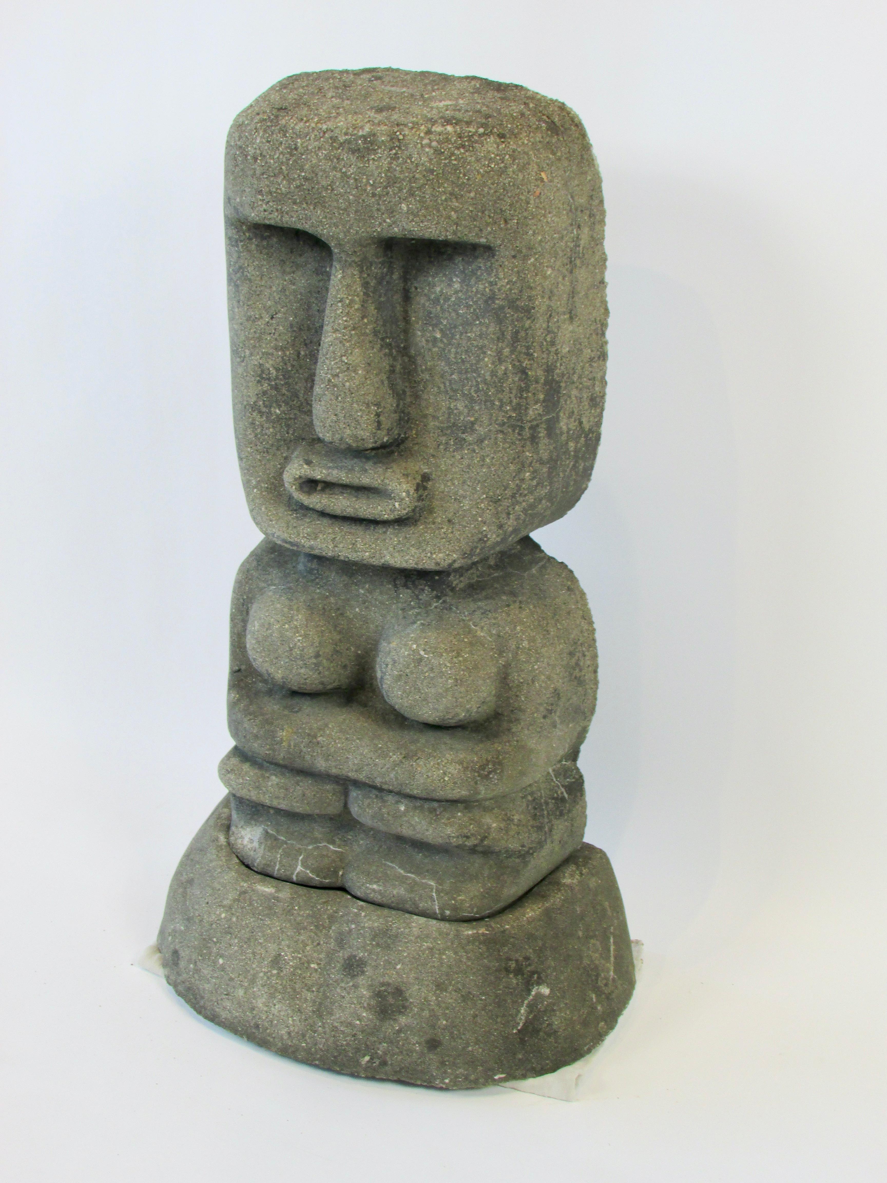 Unique two pice garden statue. Tiki style form sits in stand. Most likely cast cement.