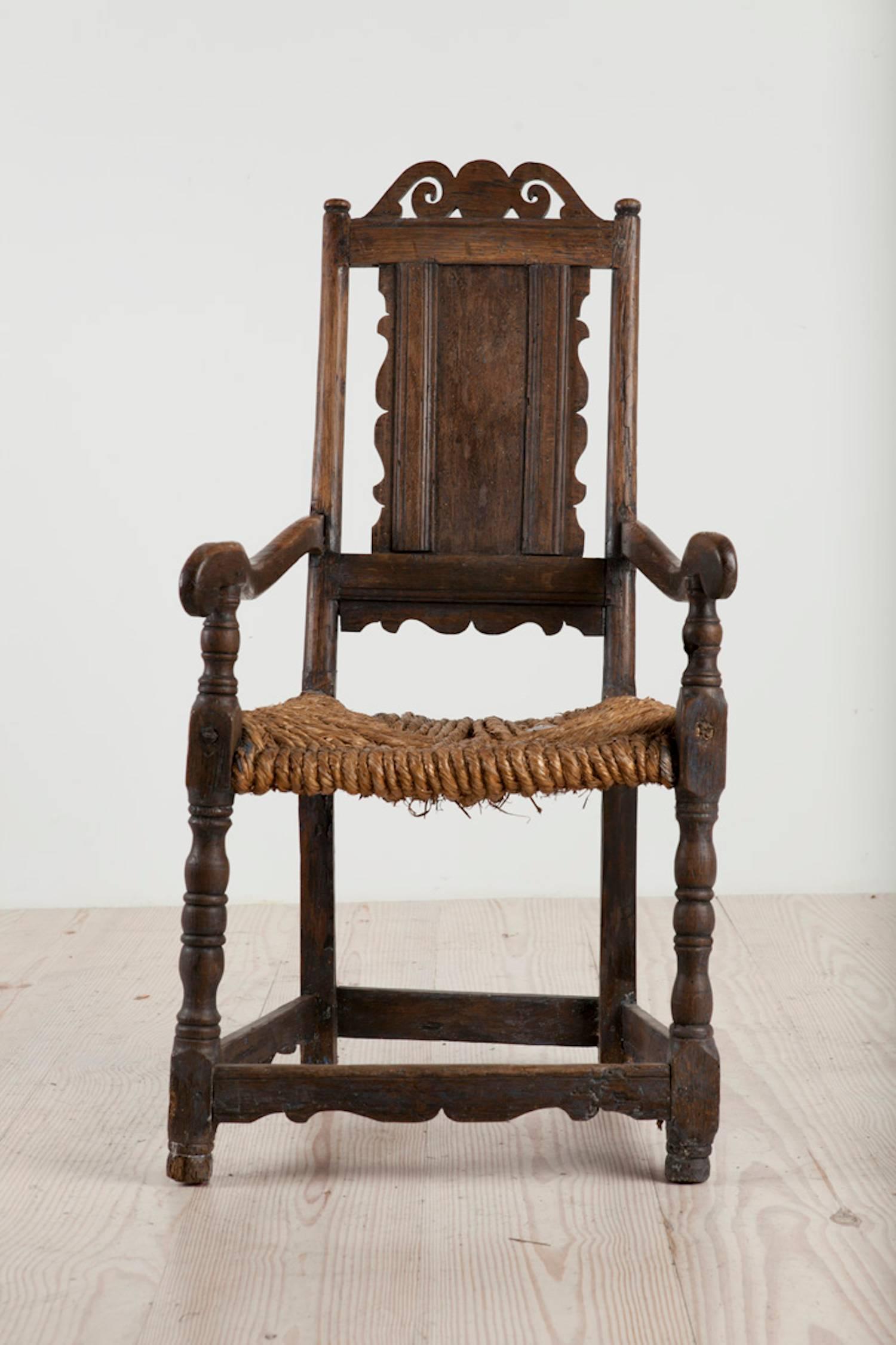 Early, Swedish allmoge poker / stove chair, origin: Blekinge, Southern Sweden, circa 1750

Provenance: Private Manor House, Sweden

These chairs were used by women to sit in / near the stove while cooking. (See attached photograph)
All original