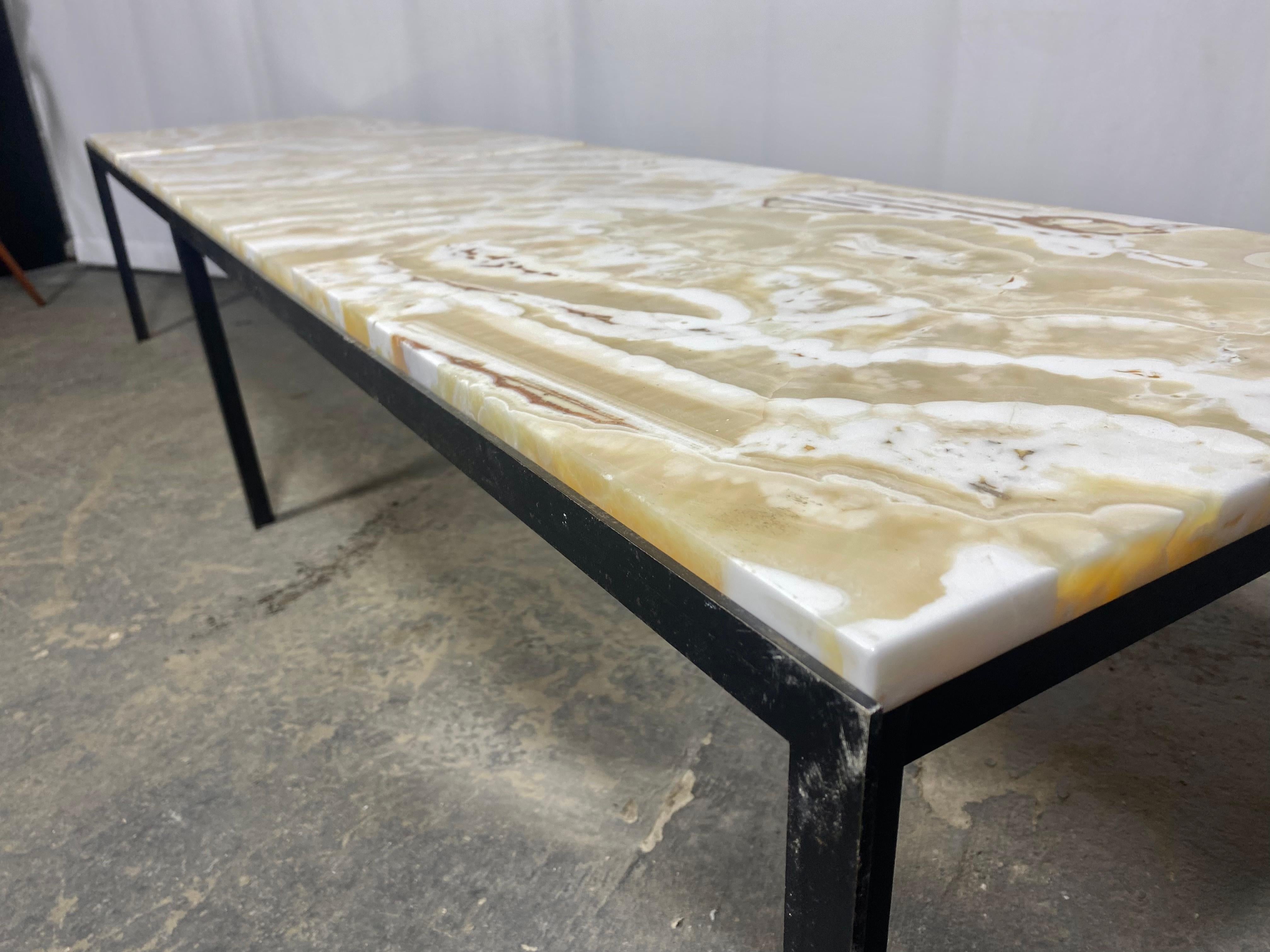 A very early and rare segmented topped onyx coffee table or bench with satin black T angled metal base . This architectural styled piece would fit into almost any interior room or entrance way with it's well crafted and simple clean lines .  retains