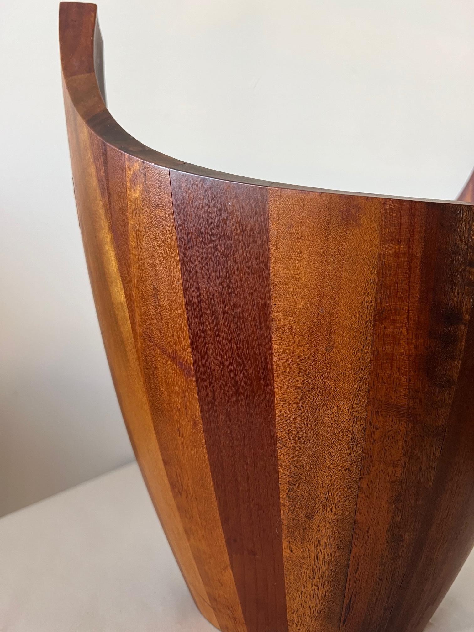 A rare and hard to find, large teak salad bowl by J.Quistgaard. Unusual form with raised handles and great patina. Note butterfly joints. Also Danish teak spoons (non Quistgaard design included).