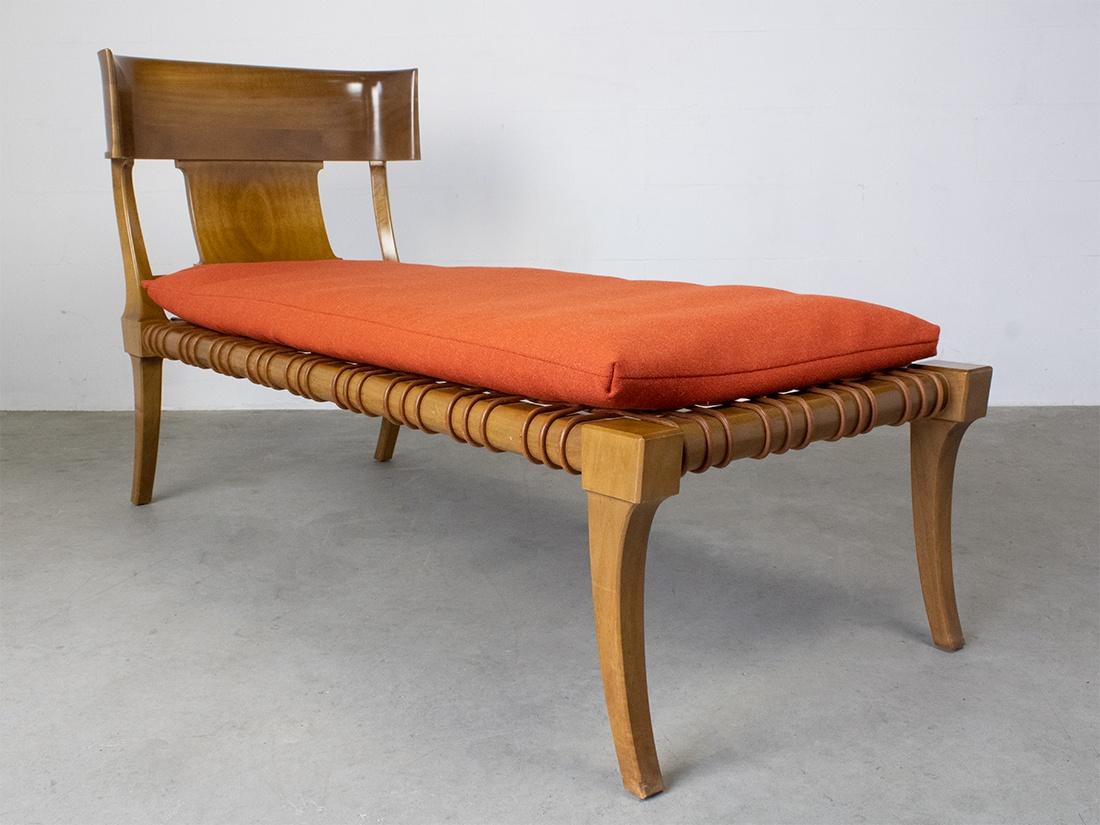 Rare early T.H. Robsjohn-Gibbings for Saridis of Athens, ‘Klini’ chaise lounge model nr. 11, in Greek walnut with leather thong, designed 1961.  An ancient Greek inspired daybed by the British designer T.H. Robsjohn-Gibbings. 
This chaise lounge was