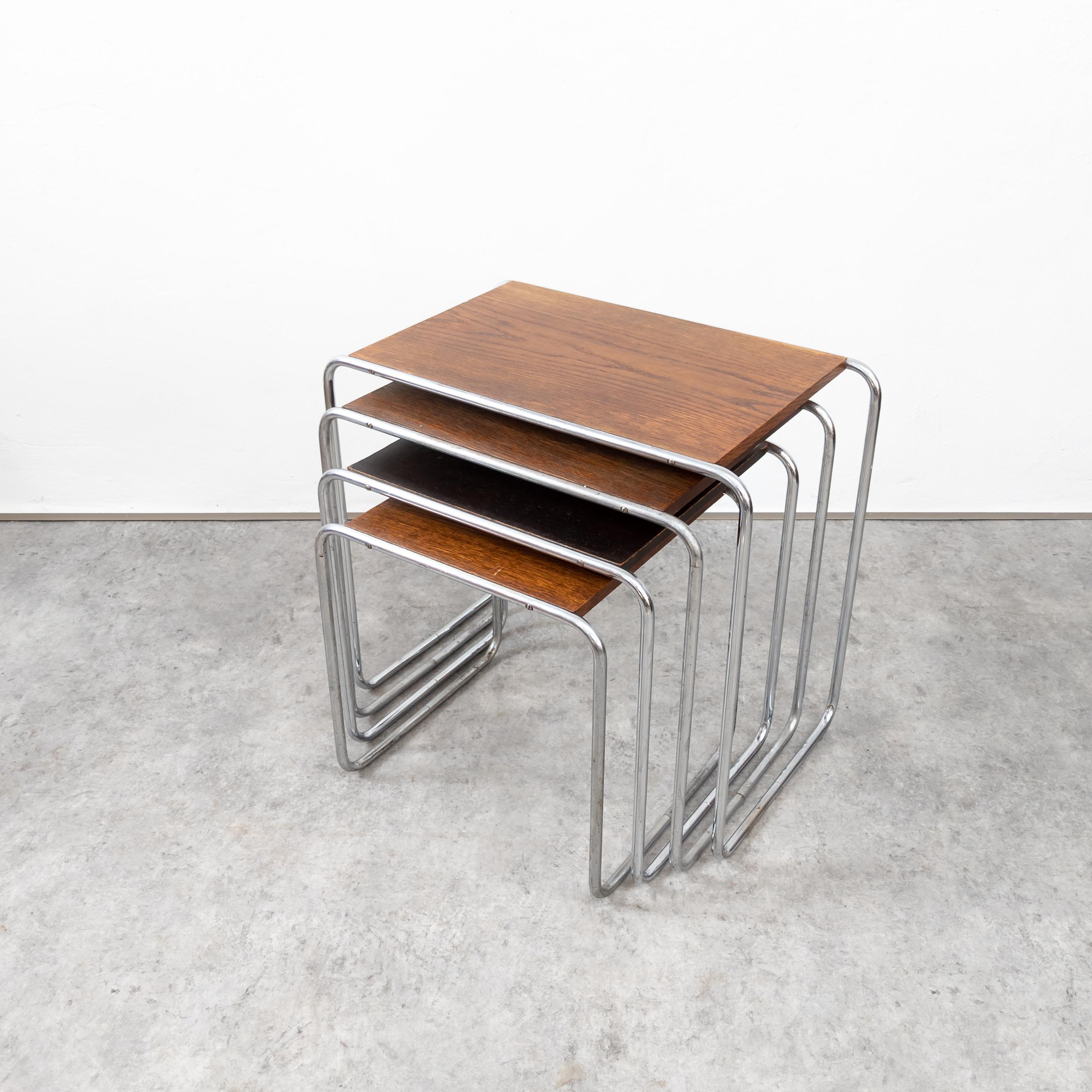 Early set of nesting tables, model B9 - 9C. Chrome-plated tubular steel and lacquered wood. Manufactured probably by Gebrüder Thonet AG, Frankenberg, These pieces, while originally designed as nesting stools, were manufactured by both Standard-Möbel