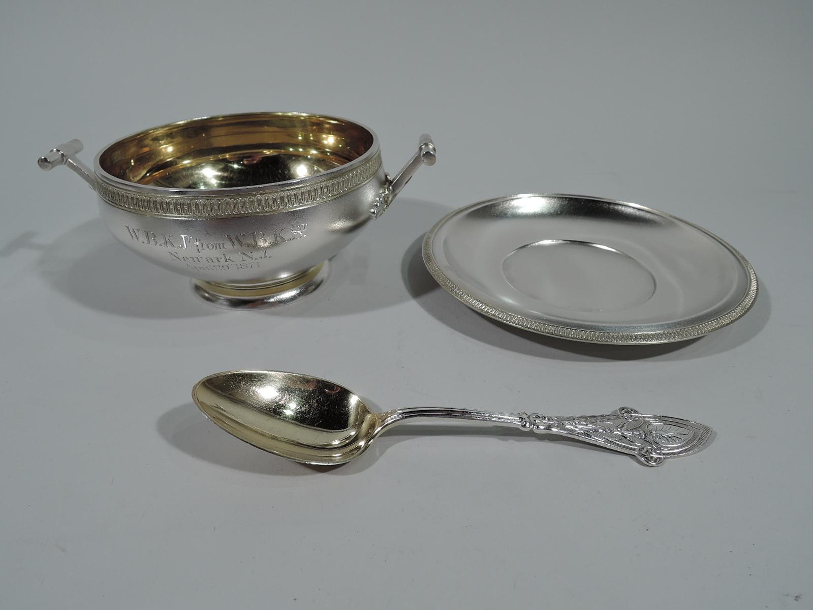 Early gilt-washed sterling silver sauce bowl on stand with butler finish. Made by Tiffany & Co. in New York. Round and tapering bowl with gilt interior and raised foot. Side handles in form of post inserted with short perpendicular column and