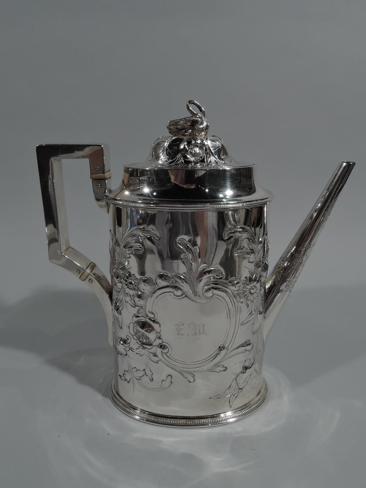 Early sterling silver 5-piece coffee set. Made by John C. Moore for Tiffany, Young & Ellis in New York. This set comprises coffeepot, creamer, sugar, hot milk pot, and waste bowl.

Each: Ovoid body with scroll bracket handle except for waste bowl,