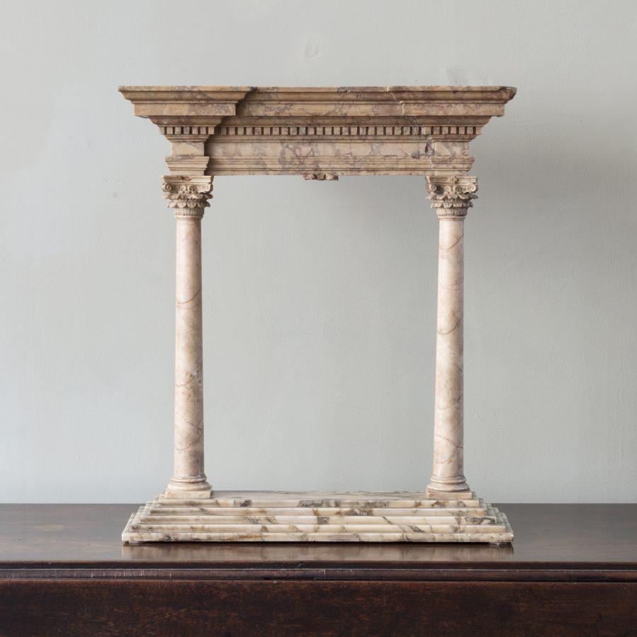 A fine early to mid-19th century Grand Tour Portico, with molded strepped cornice above a pair of foliate capped columns on stepped base.
Italian, circa 1830.
