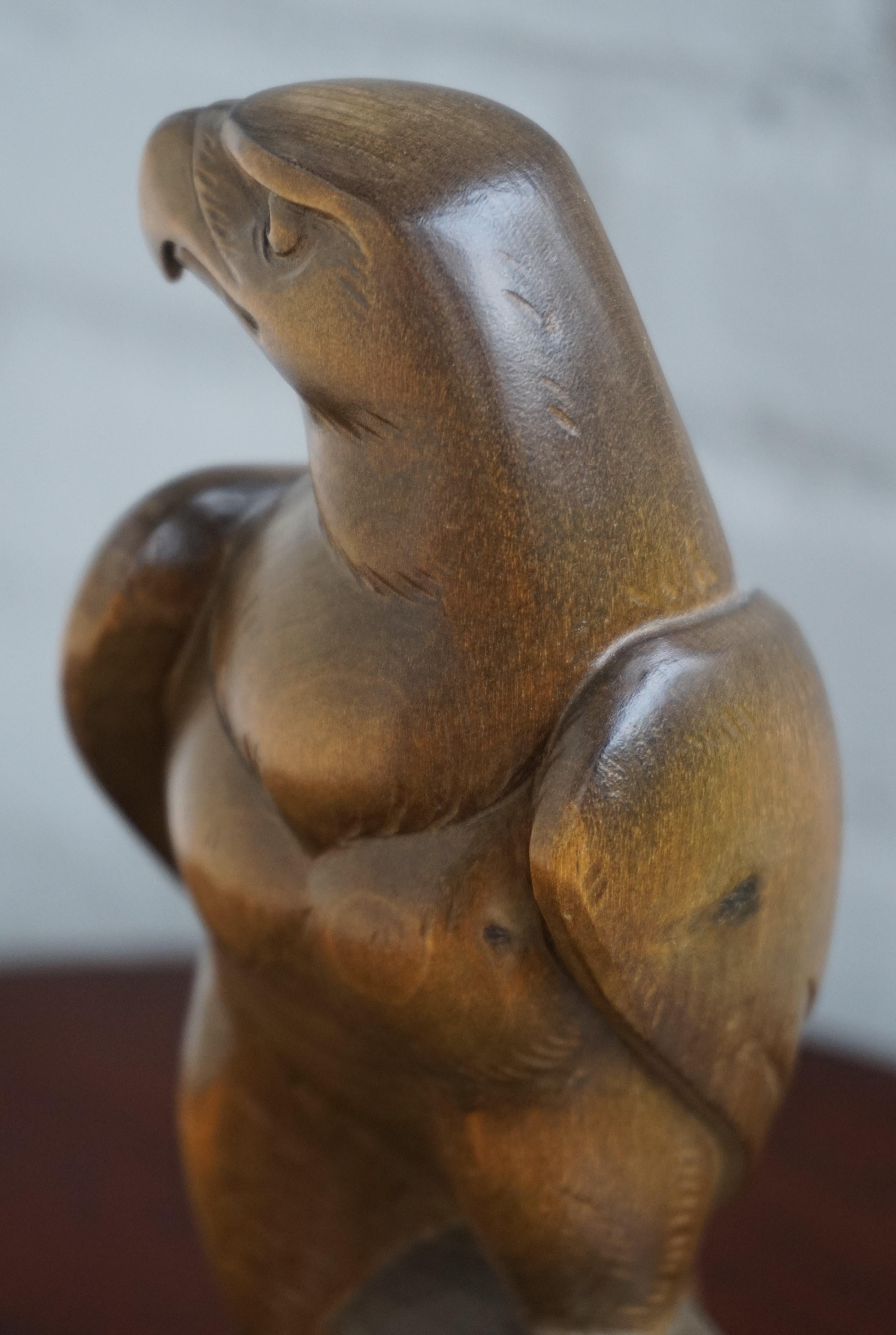 European Early to Mid-20th Century Hand Carved Black Forest Sitting Eagle Sculpture For Sale