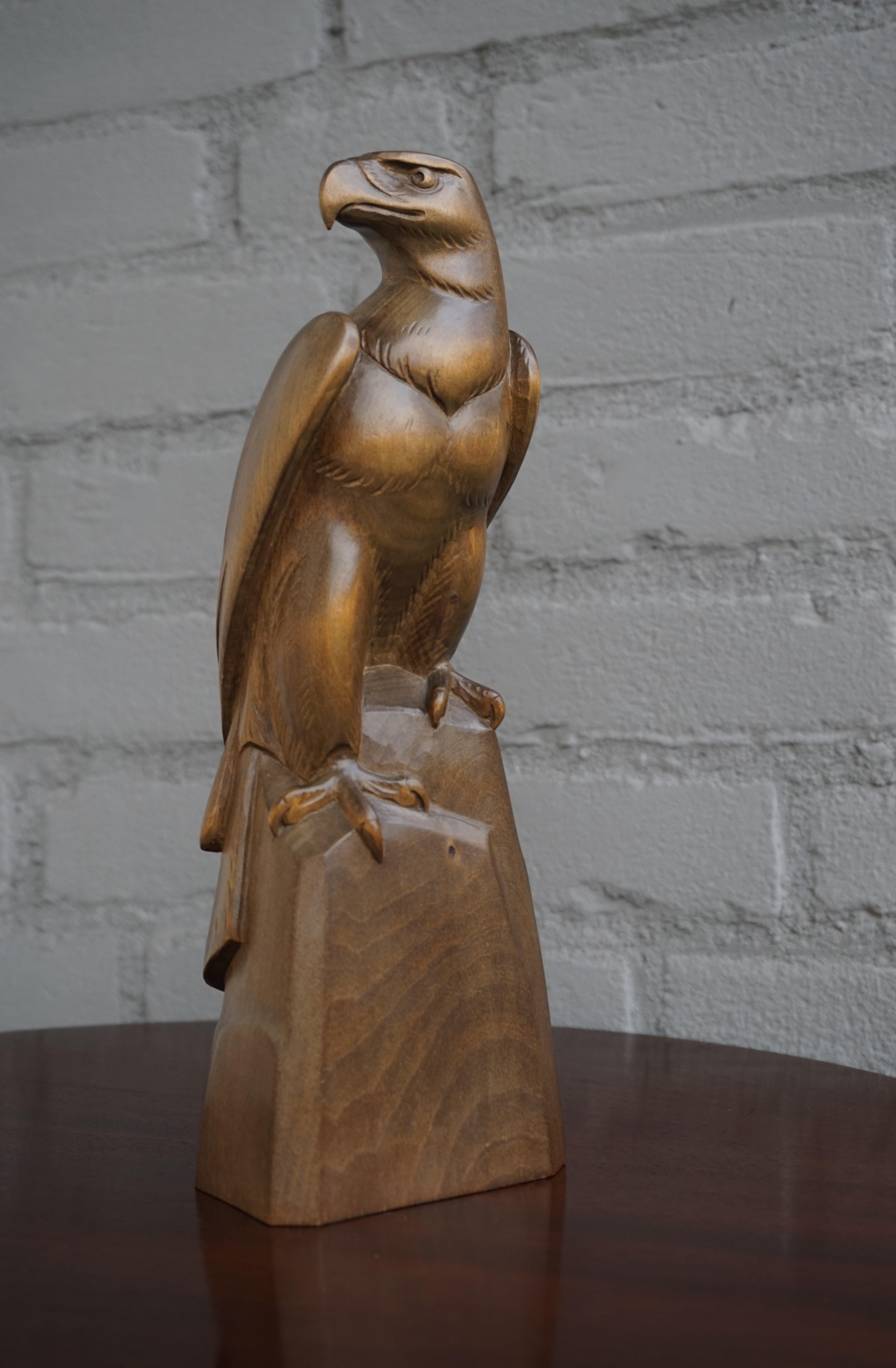 Patinated Early to Mid-20th Century Hand Carved Black Forest Sitting Eagle Sculpture For Sale