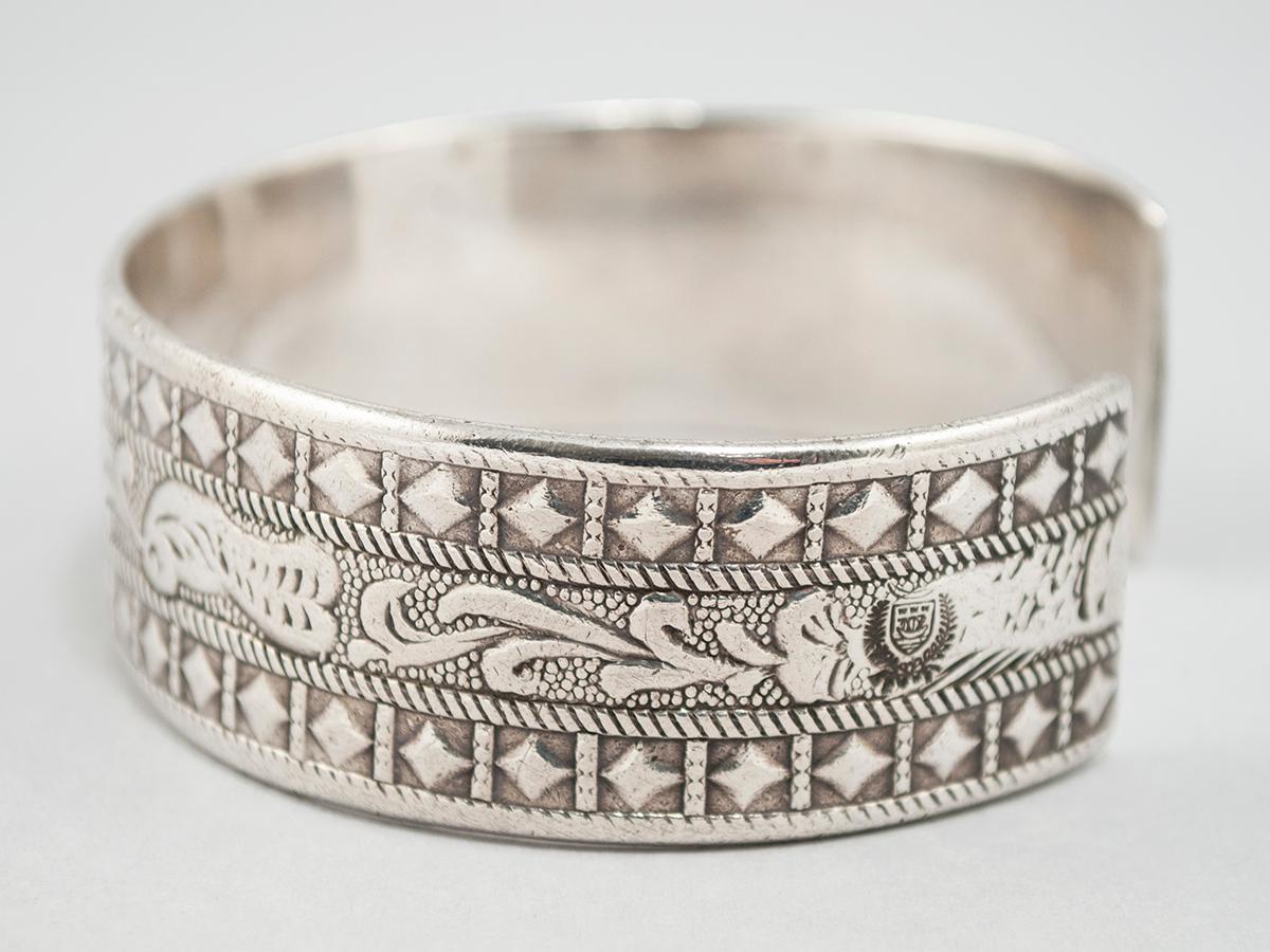 Early to Mid-20th century silver tribal bracelet, Berber people, Libya

Wonderful chased designs of doves, stars, diamonds and leaves. The stamp of Libya can be seen in one of the side photos and there are no hallmarks on the interior.
8