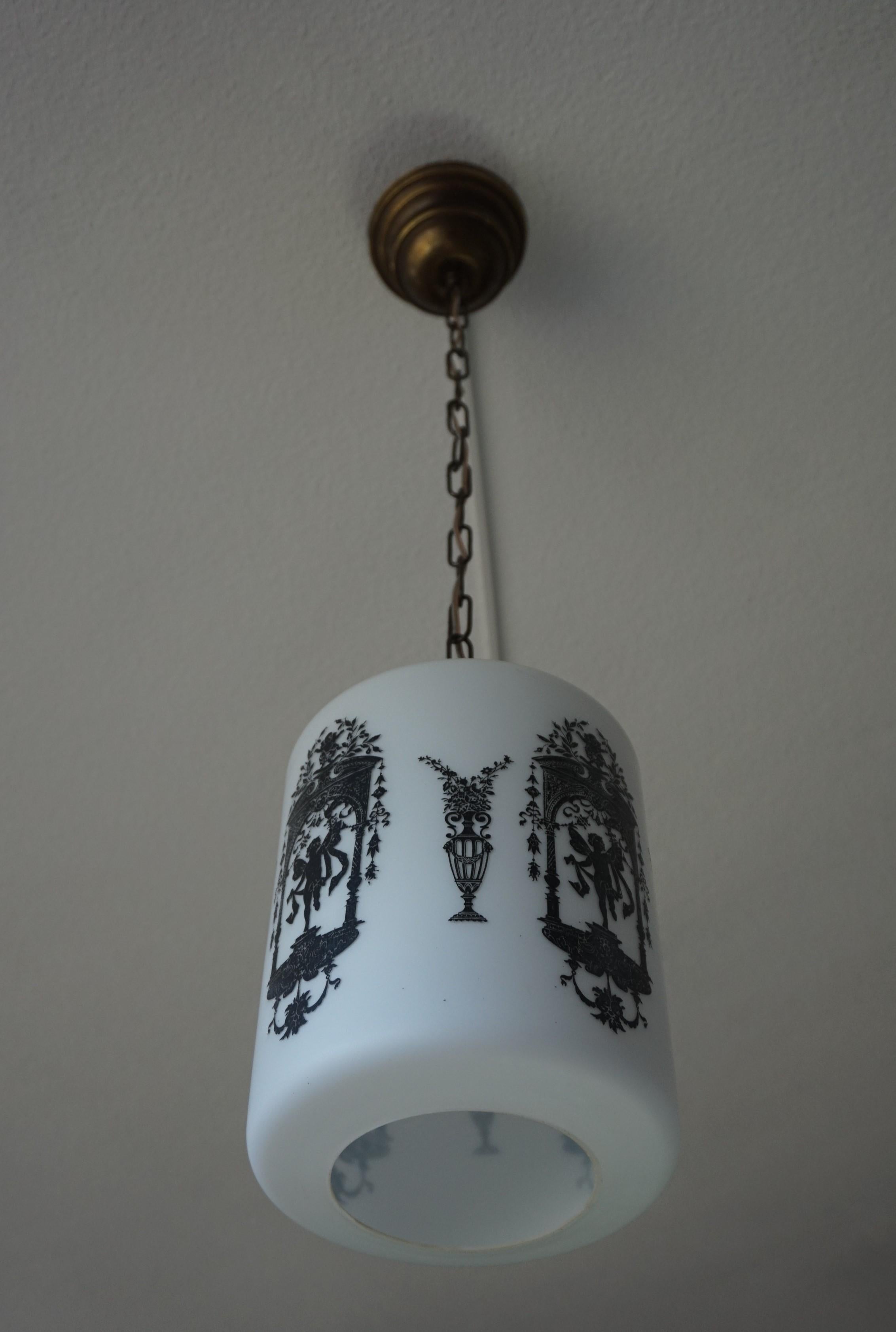 European Early to Mid-20th Century Snowy White Glass Pendant with Black Renaissance Decor For Sale