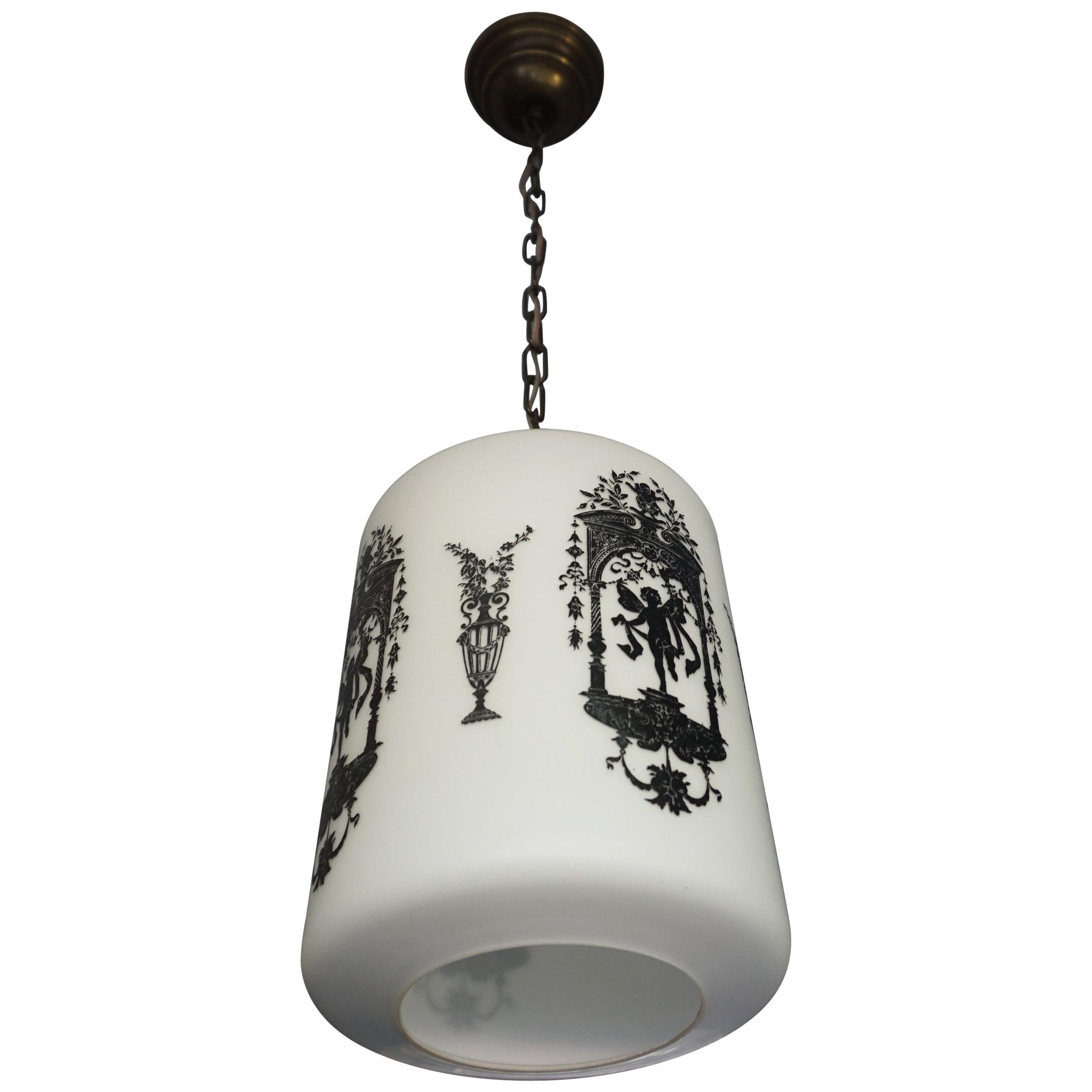 Early to Mid-20th Century Snowy White Glass Pendant with Black Renaissance Decor For Sale