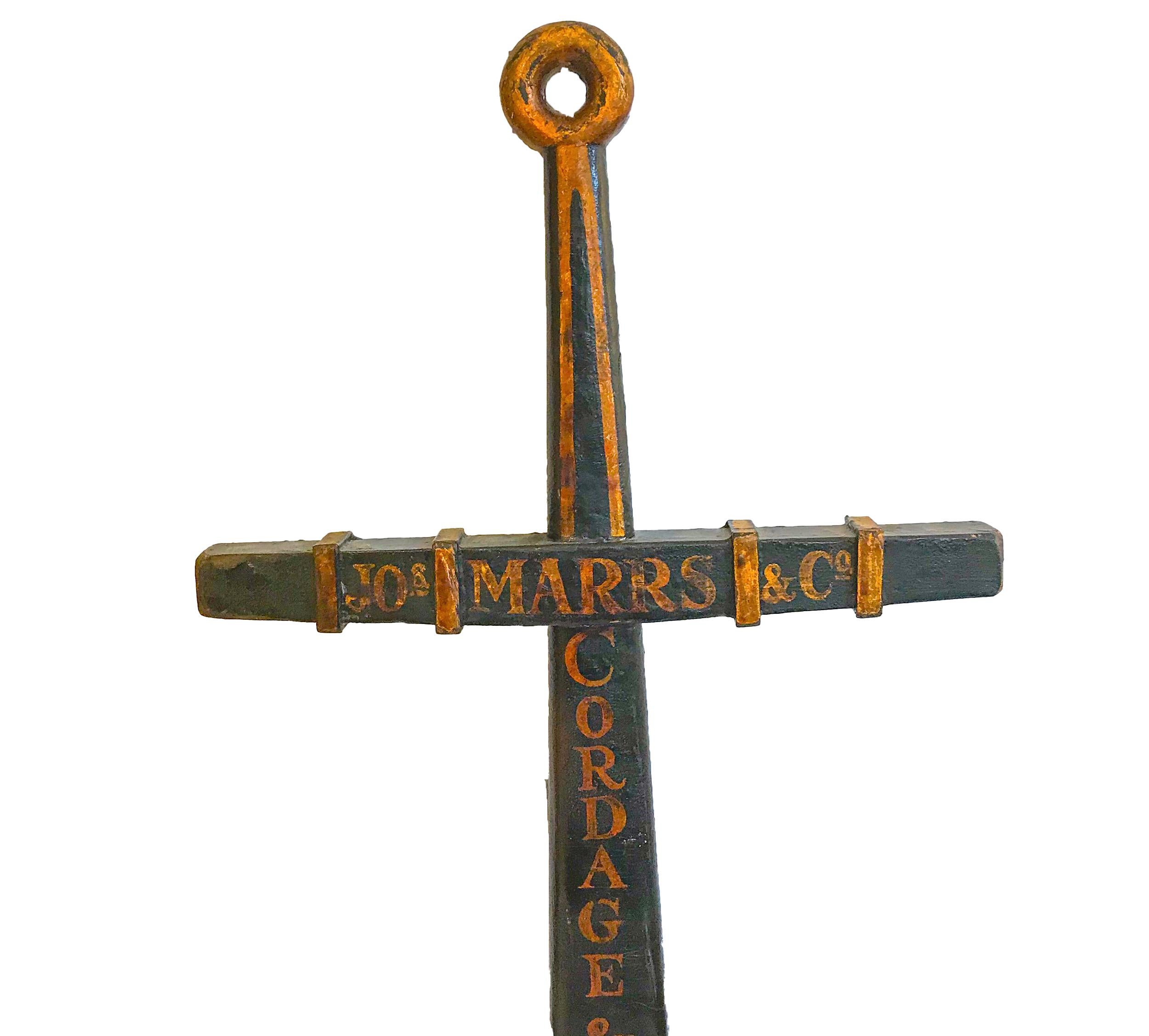 Large early to mid-20th century carved and painted wood anchor form trade sign in black and gold paint 