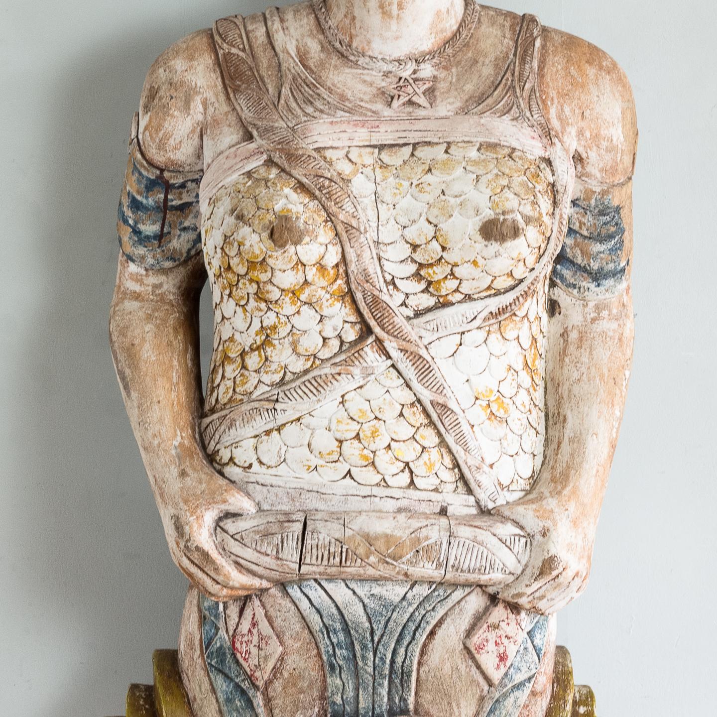 An early 20th century English carved figurehead of Queen Boudica, with remnants of old polychromatic painted decoration, removed from a London Dockside pub.