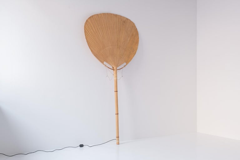 Early ‘Uchiwa’ floor lamp by Ingo Maurer for M Design, Germany 1977. This lamp was handmade from bamboo, wicker and Japanese rice paper. Some age related marks, but overall in a very good condition. Collector’s item.