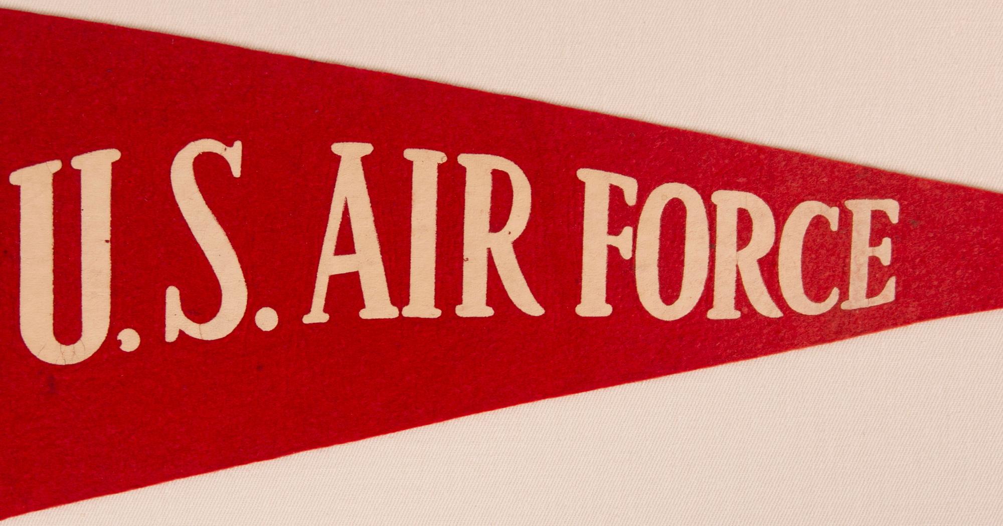 EARLY UNITED STATES AIR FORCE PENNANT, MADE NEAR THE TIME OF ITS INCEPTION AS ITS OWN BRANCH OF THE MILITARY, circa 1947-1950’s

Felt pennant with a blue panel along the hoist end and a red field beyond, joined by machine stitching, made to