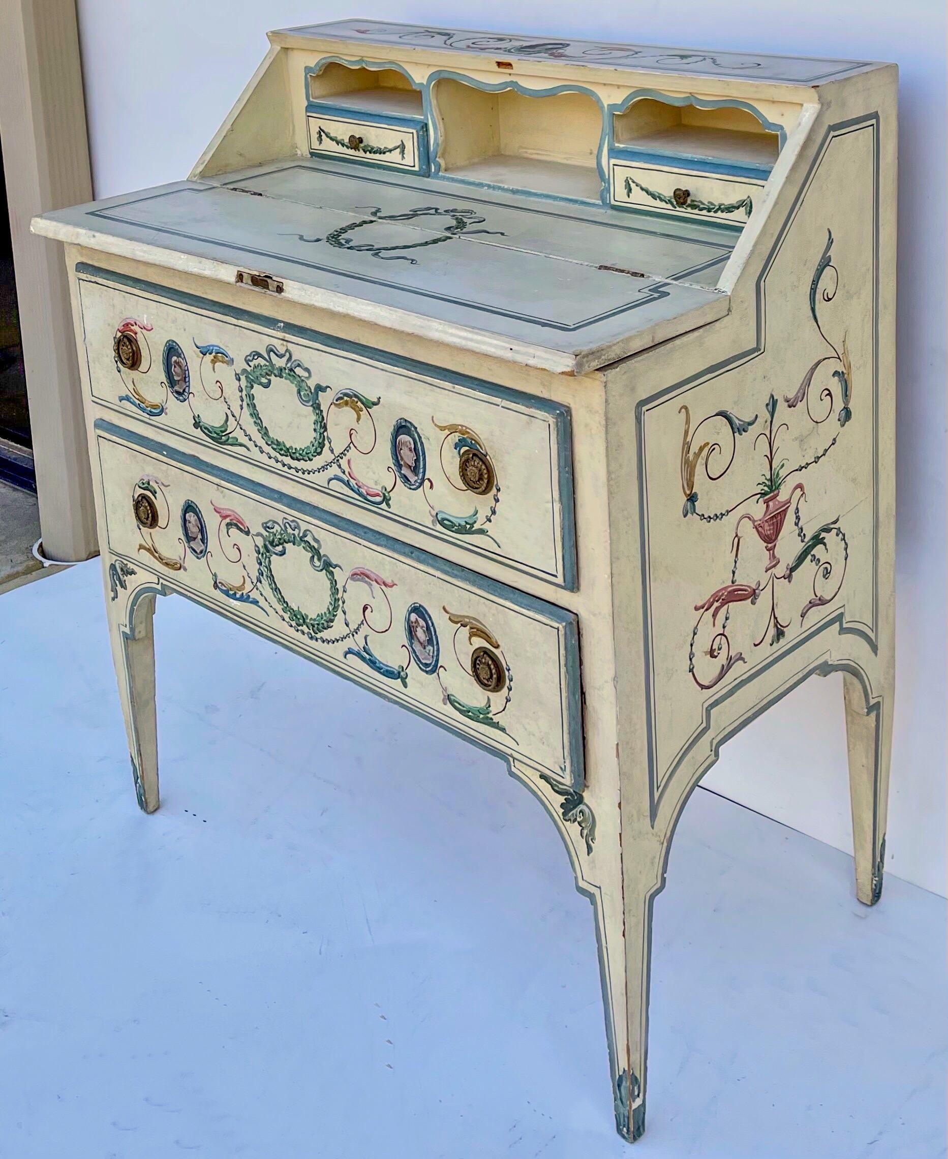 This is a wonderful piece. It is an early Venetian neo-classical style secretary desk with original paint. It does have the key. It has painted greco-roman portraiture and foliate throughout the body and interior.