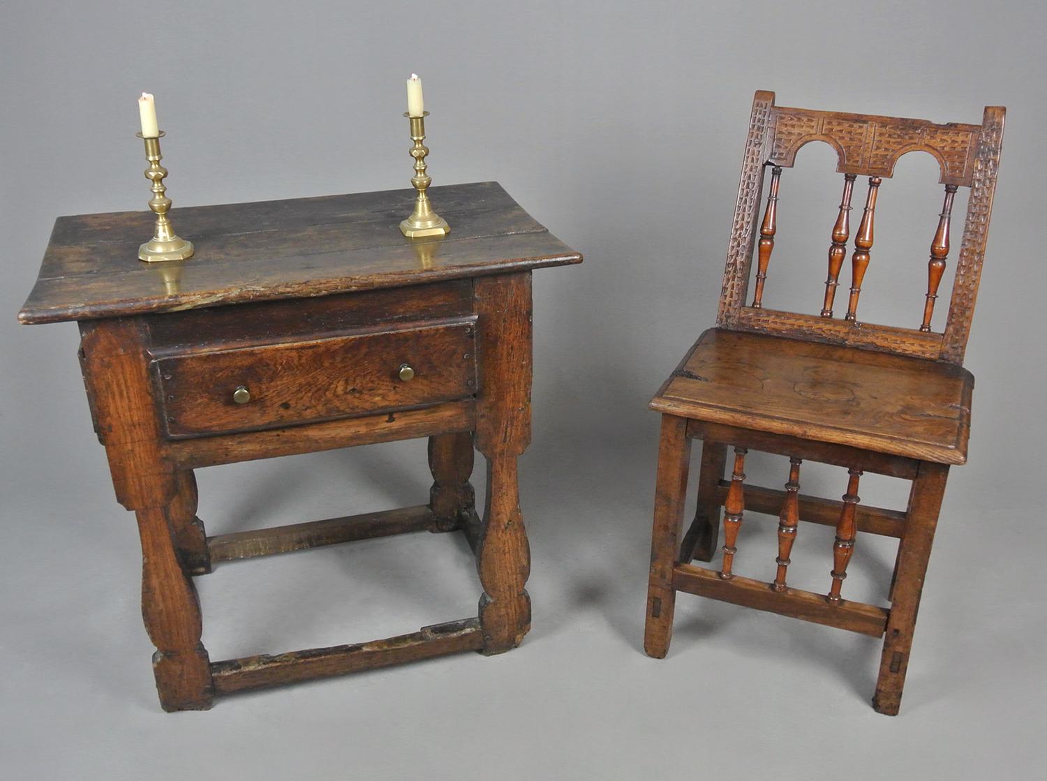 An absolutely beautiful and very early walnut chair with finely turned yew wood spindles, exposed tenons, chip carved U-gouge running cable decoration. Original timbers and pegs throughout other than the flanking (farthest back and furthest front)